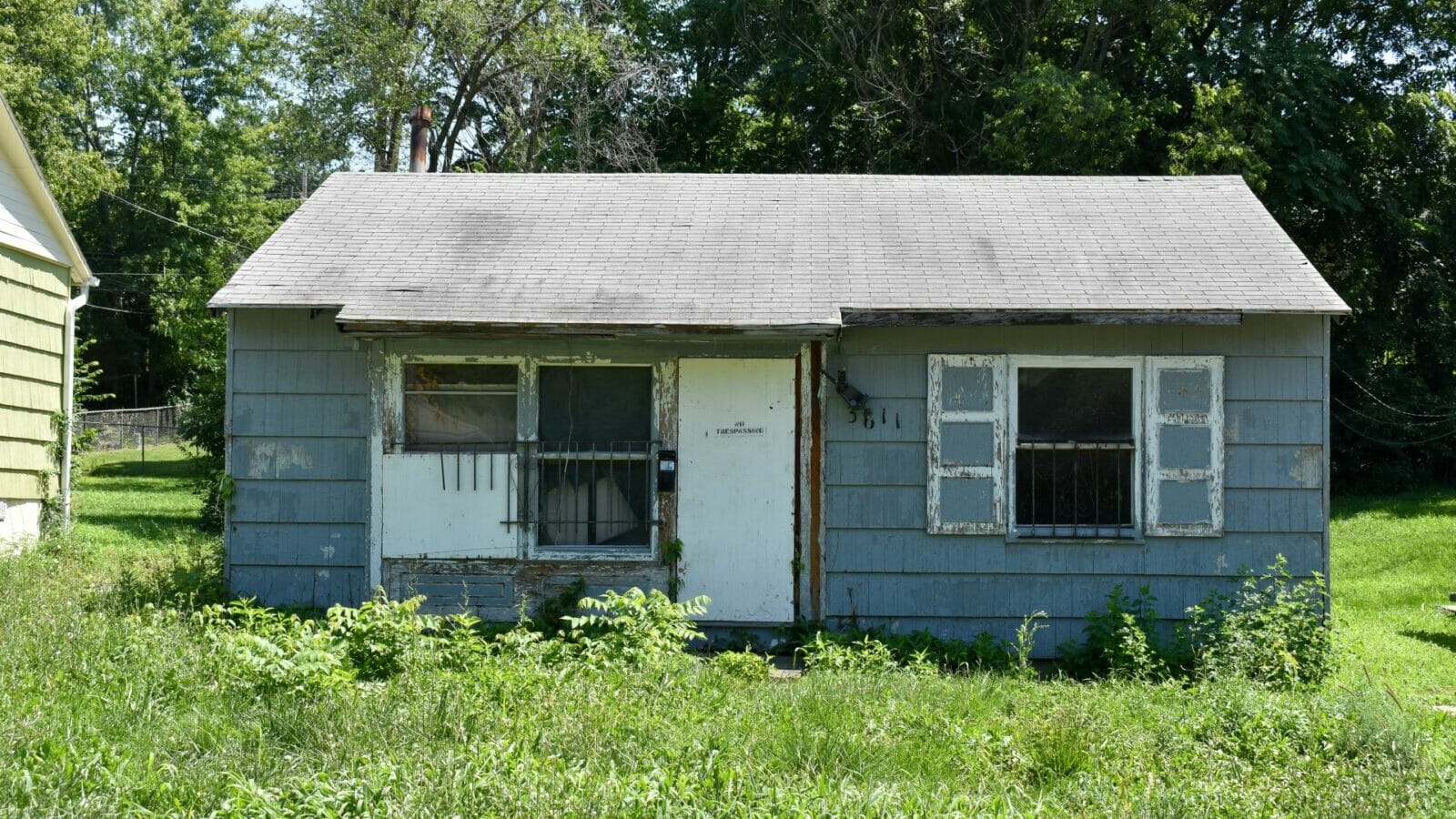 This neglected house at 3611 Norton Ave. was reported to the Kansas City 311 program in March 2021.