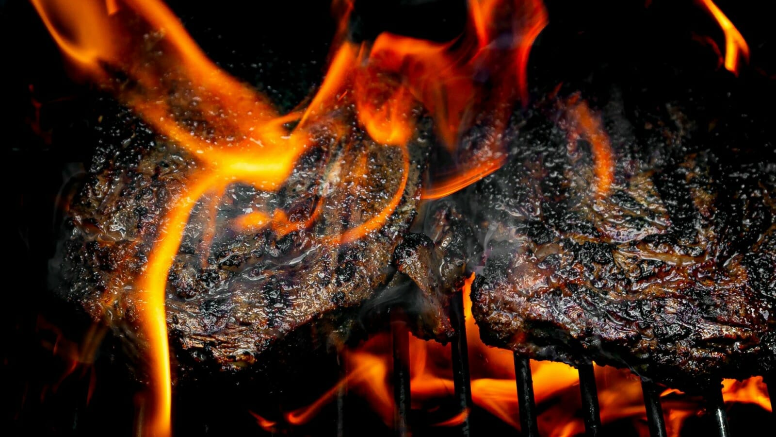 Barbecue engulfed in flames.