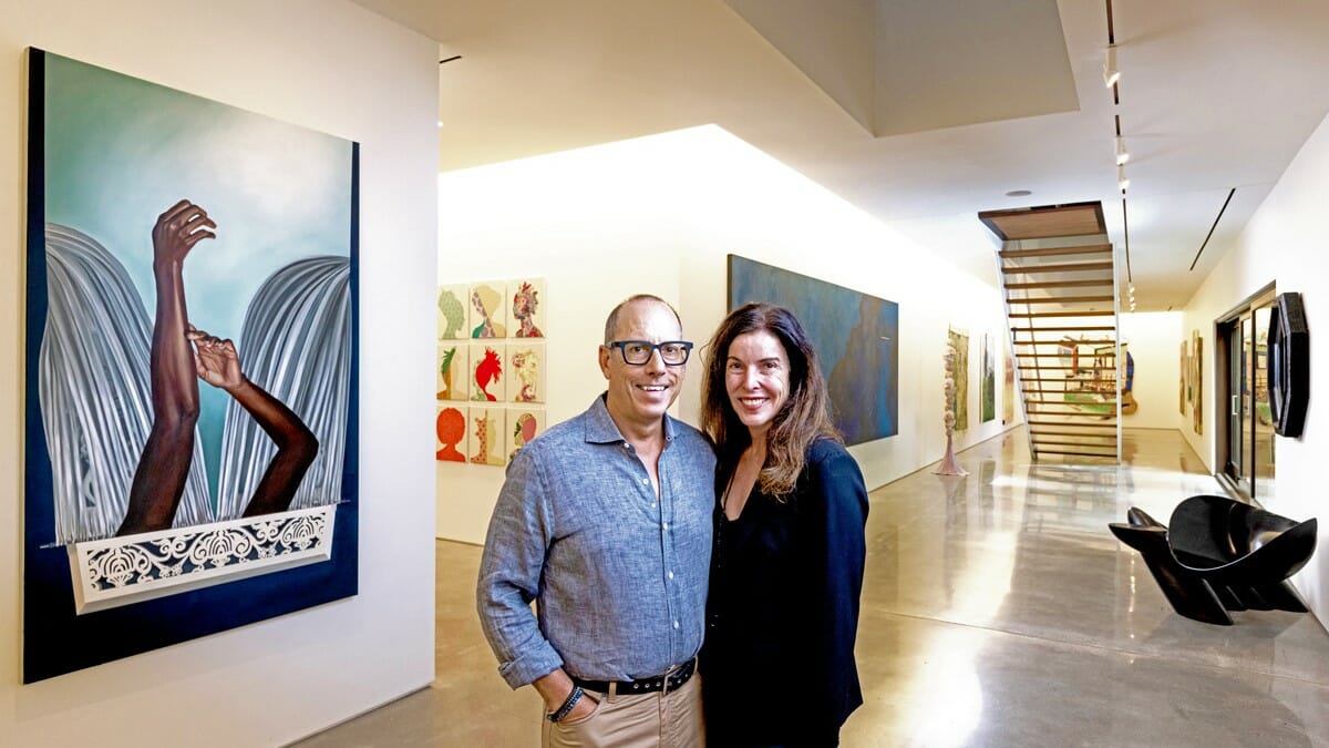 Bill and Christy Gautreaux with part of their collection inside their home.