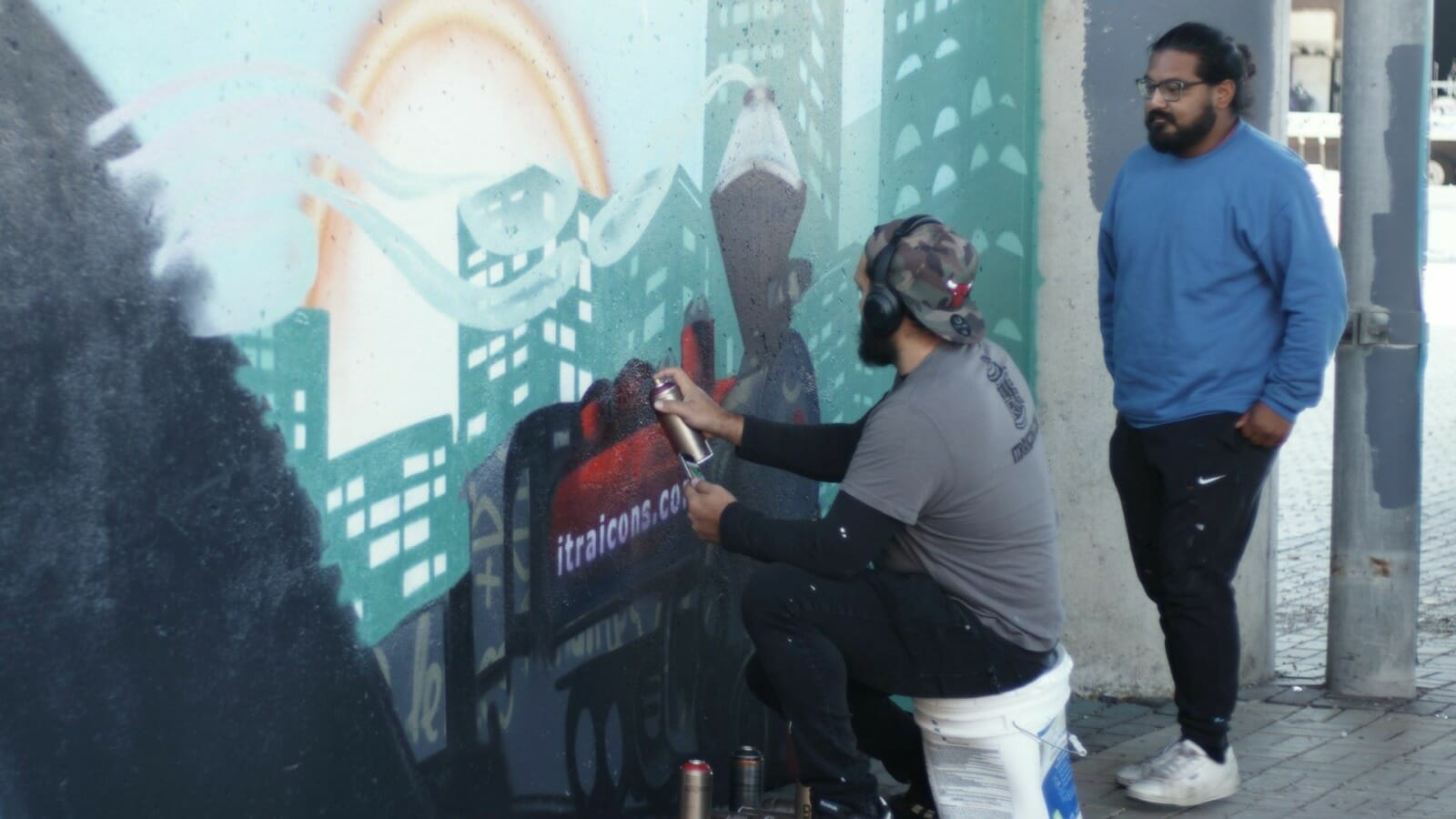 Isaac Tapia (right) and Rodrigo Alvarez are partners in ITRA, which has created more than 45 murals and other artworks in recent years.