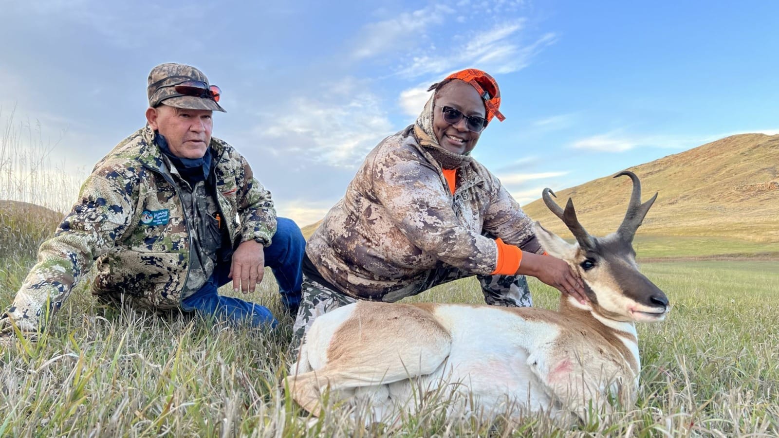 New hunter Antonette Coffee of Topeka posed with her guide, Mike Ellenwood, and the results of her first-ever hunting trip, an antelope buck.
