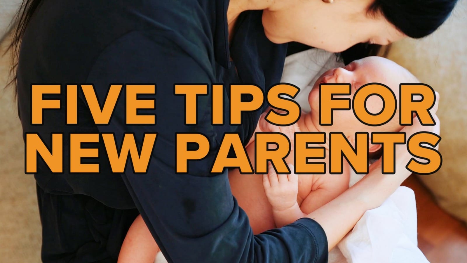 A parent holds a baby.