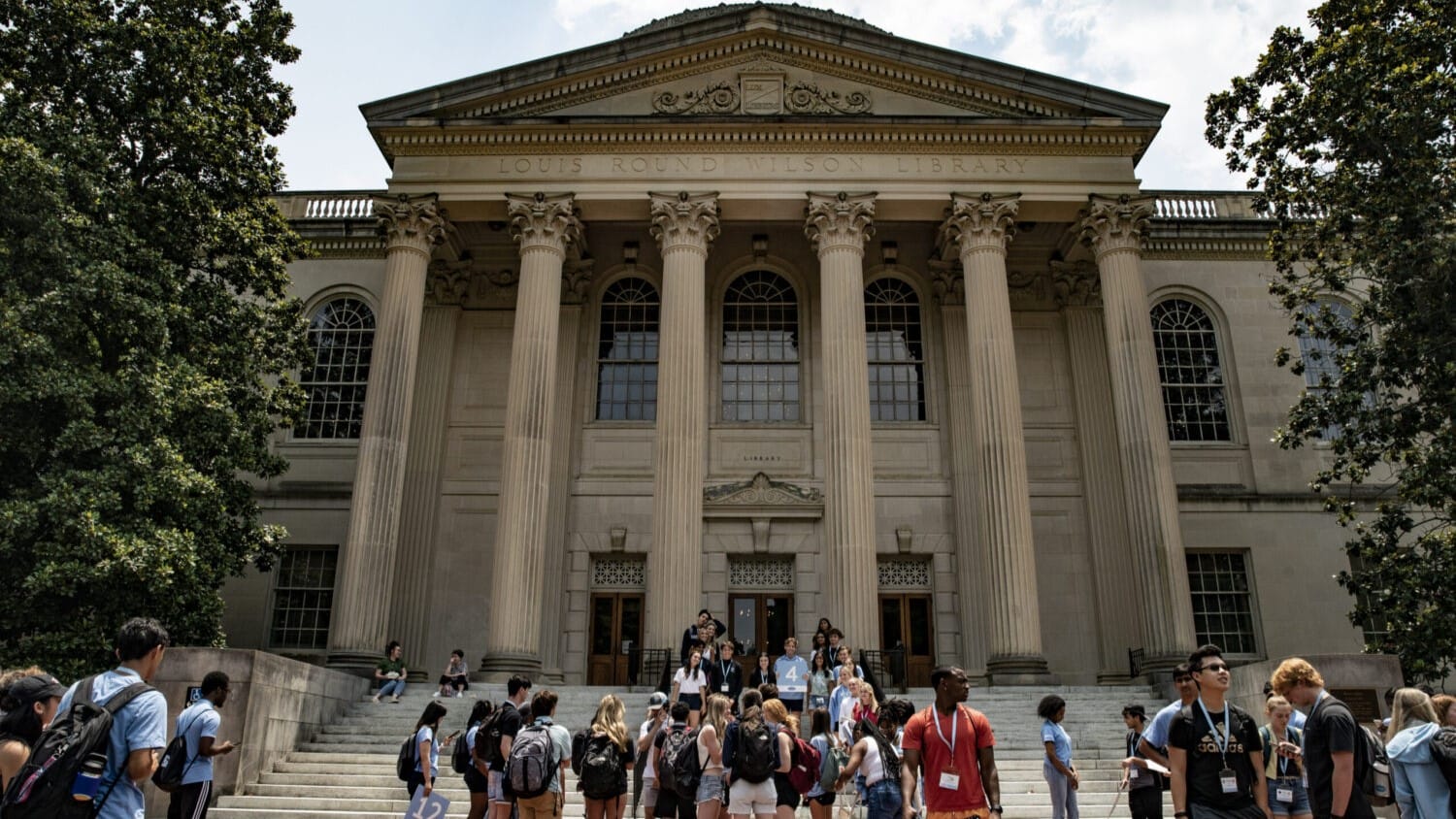 People walk on the campus of the University of North Carolina at Chapel Hill.