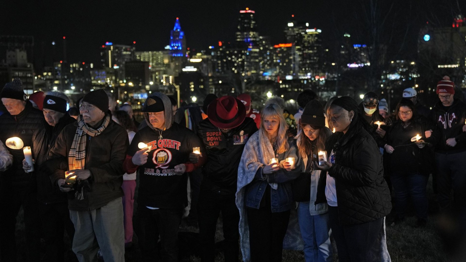 People attend a candlelight vigil for victims of a shooting at a Kansas City Chiefs Super Bowl victory rally Thursday, Feb. 15, 2024 in Kansas City, Mo. More than 20 people were injured and one woman killed in the shooting near the end of Wednesday's rally held at nearby Union Station.