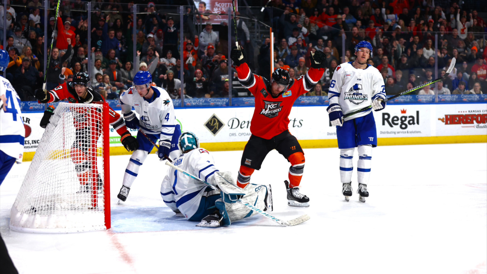 A KC Mavs hockey player takes a shot.