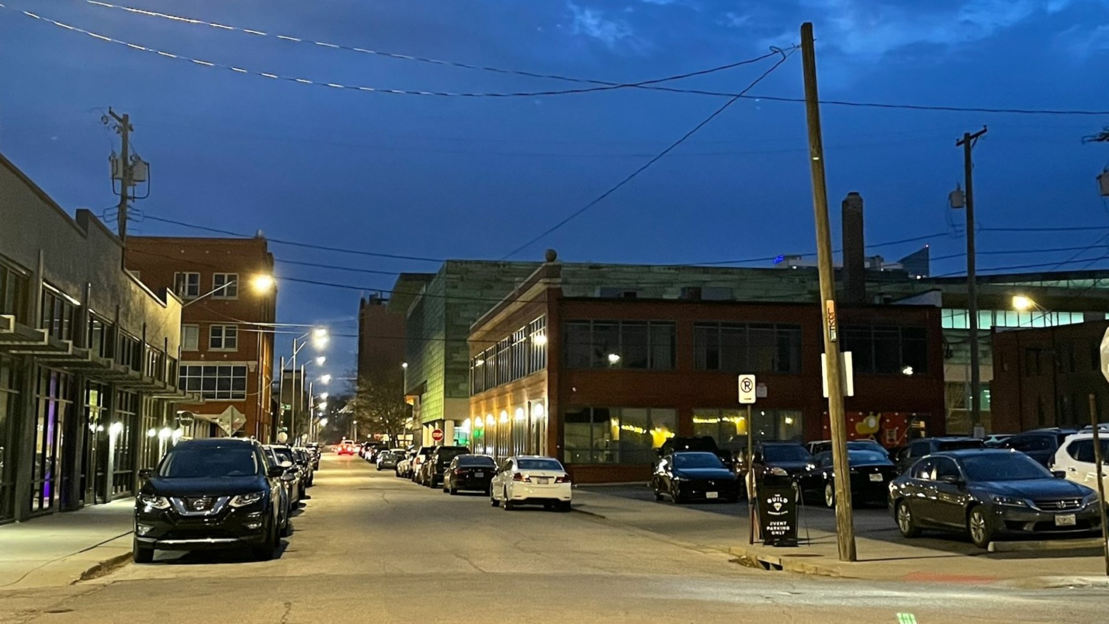 Cars parked on the streets in the Crossroads.