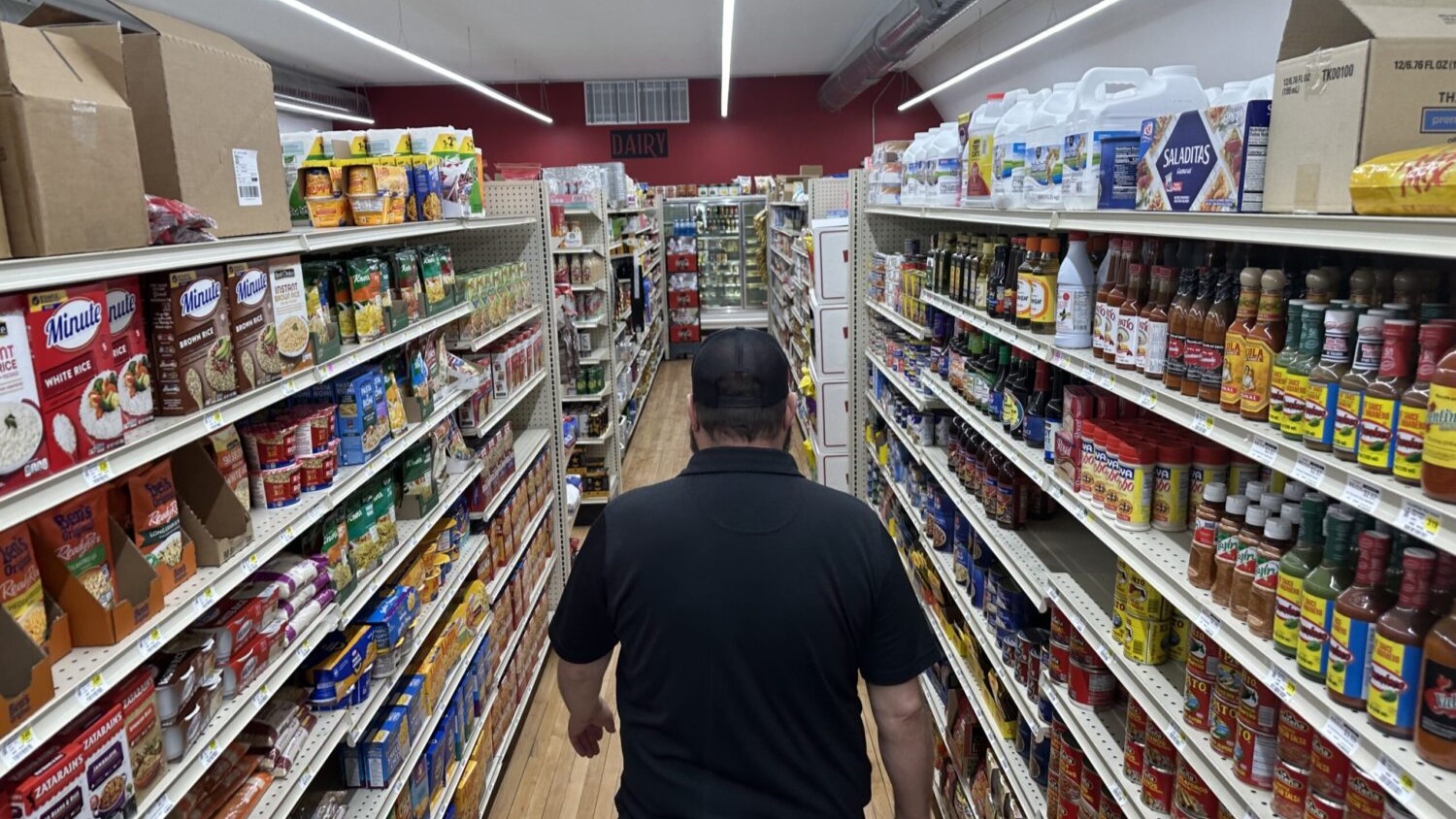 General Manager Brian Horak walks down an aisle at Post 60 Market in Emerson, Neb.