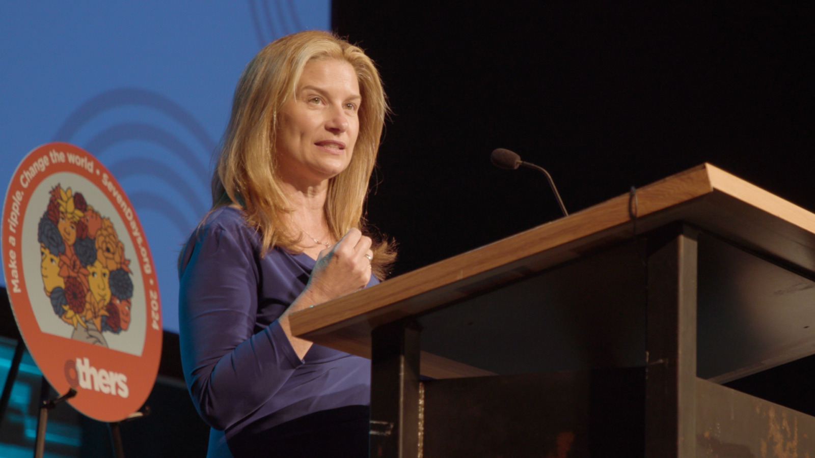 Mindy Corporon speaking at podium.