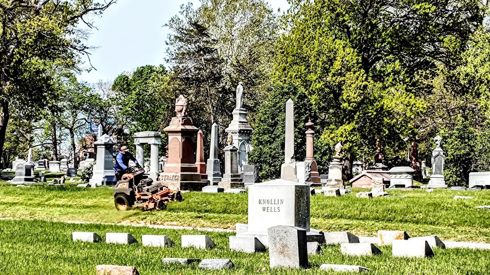 Elmwood Cemetery being mowed.