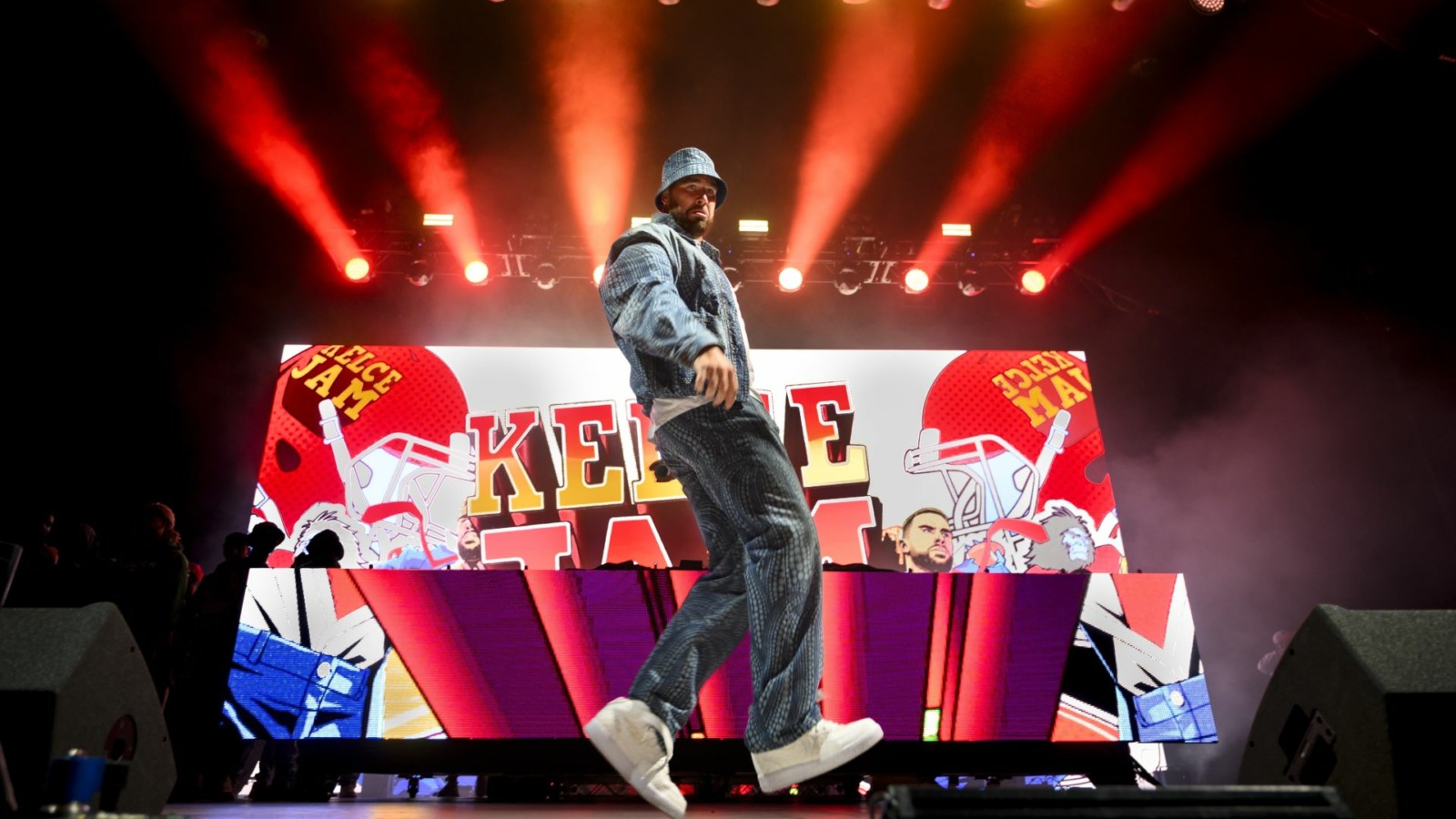 Travis Kelce, Kansas City Chiefs tight end and host of Kelce Jam, dances across the stage during the music festival on Friday, April 28, 2023, in Bonner Springs, Kansas.