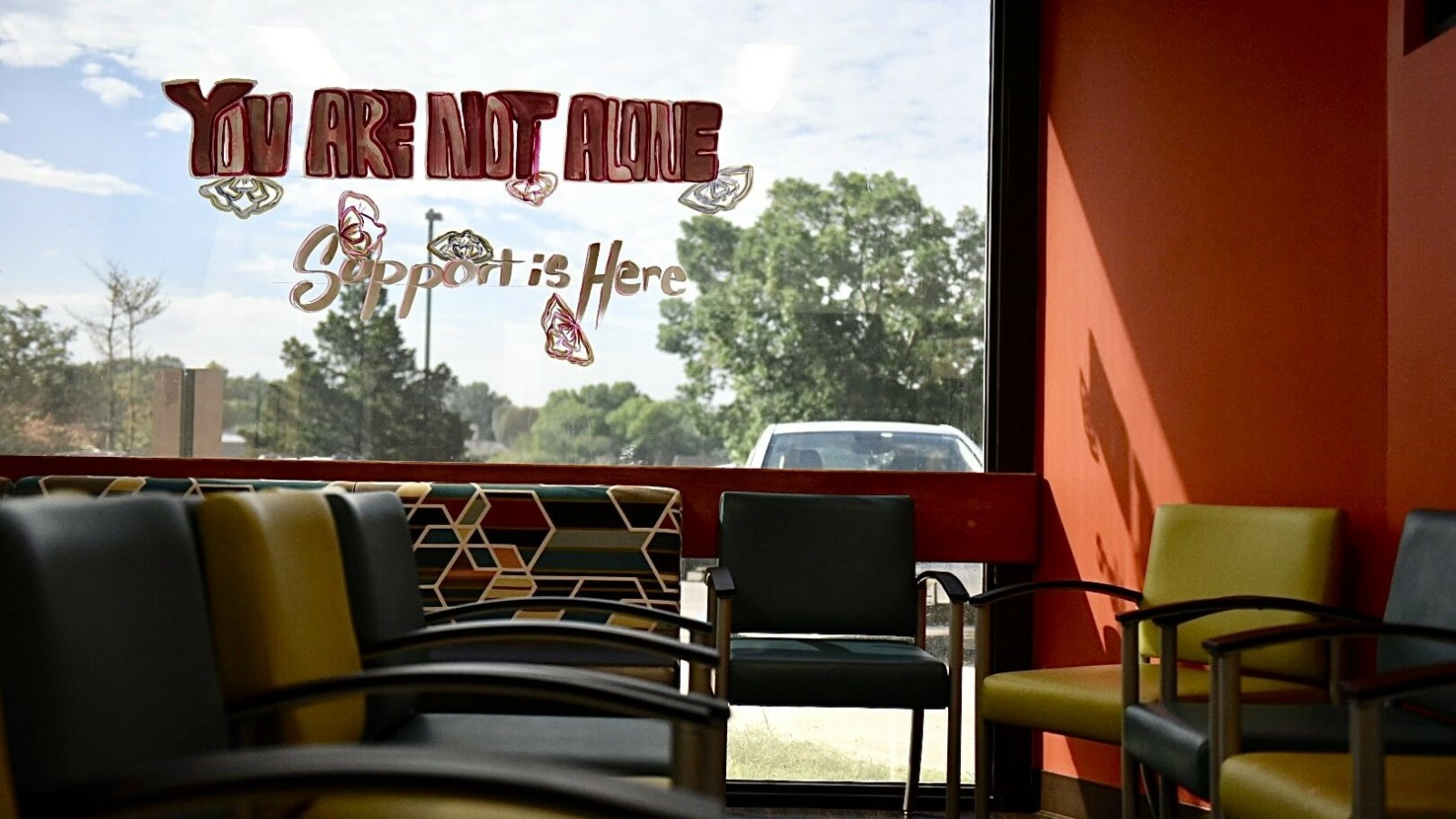 The message “You are not alone, support is here” is painted on the window of the Planned Parenthood Great Plains on Friday in Overland Park, Kansas.