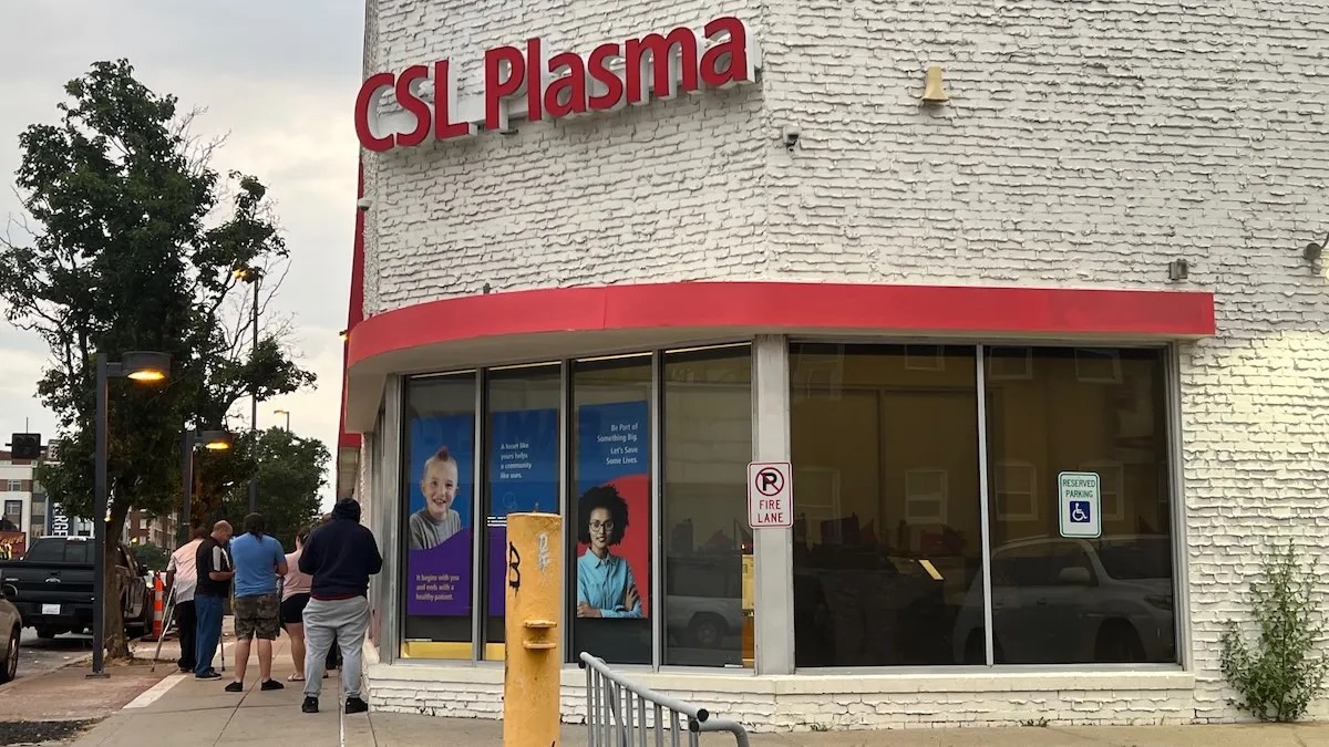 At CSL Plasma on Broadway Boulevard in midtown Kansas City, willing plasma donors line up on a recent day before the center's 6 a.m. opening.