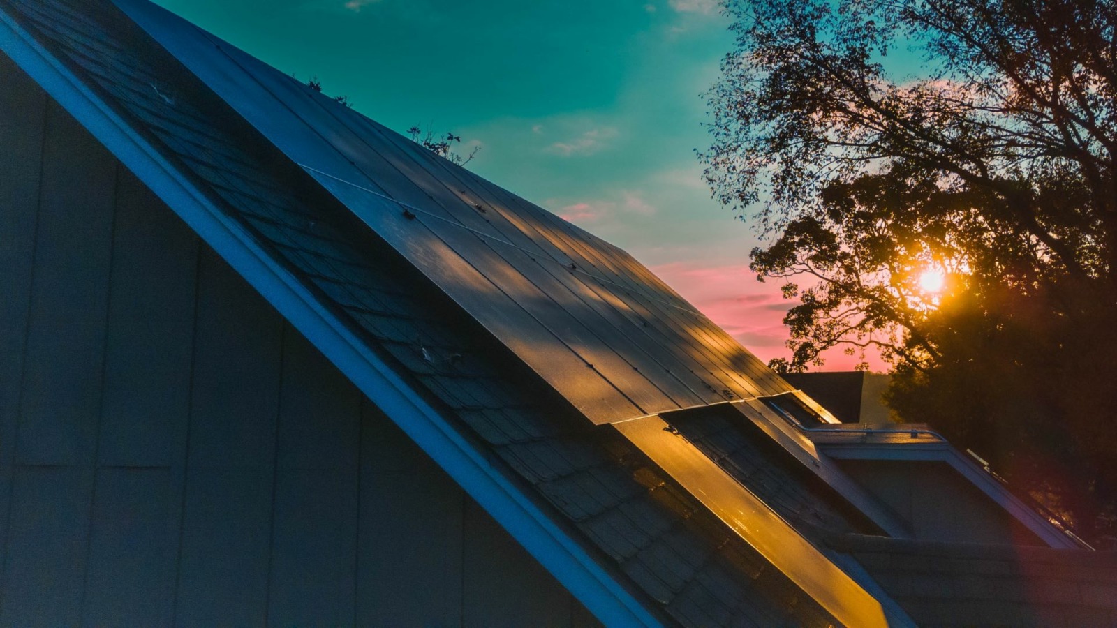 The morning light reflects off rooftop solar panels in the Lakewood subdivision.