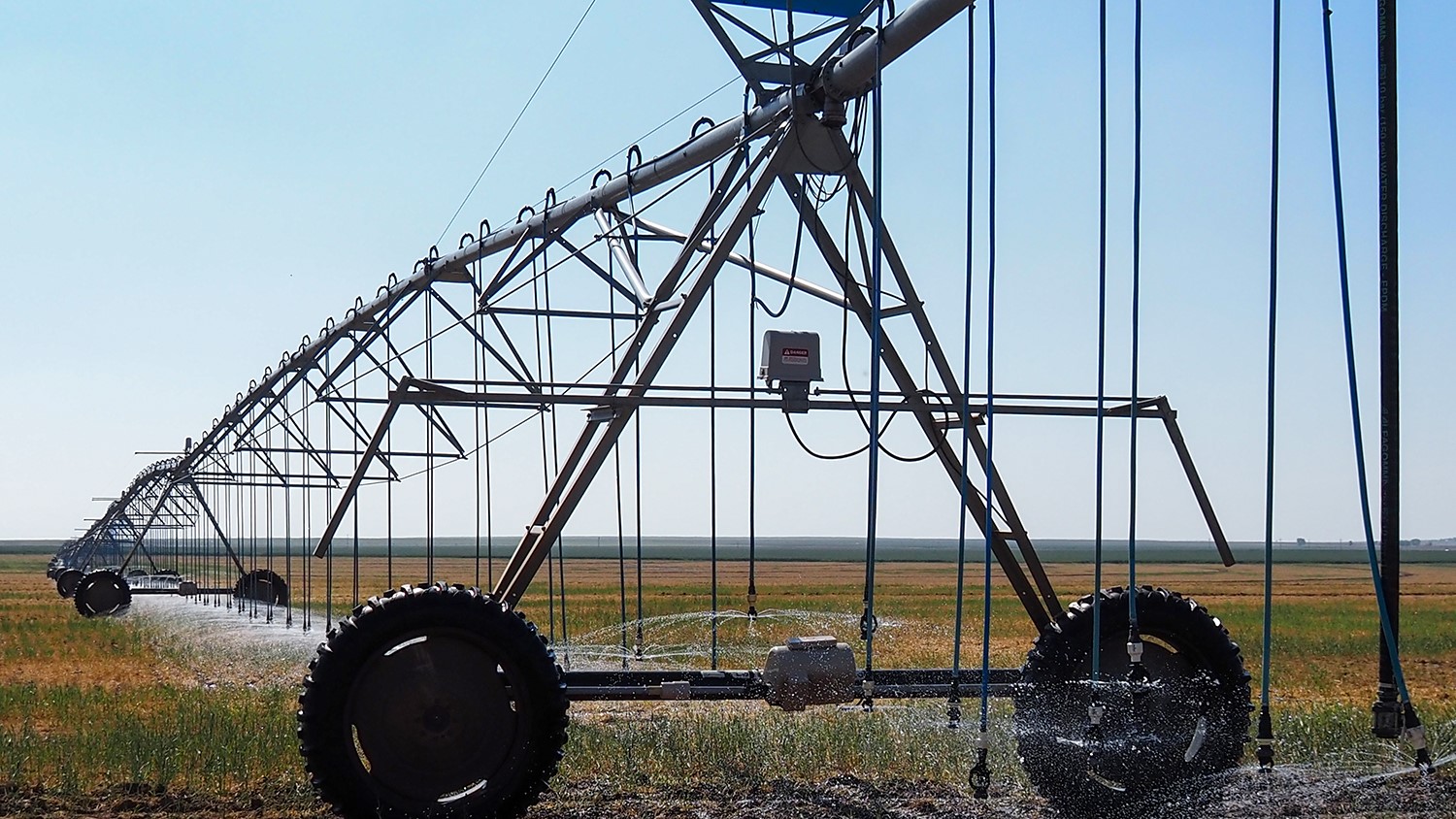Sprinklers irrigate a field in Hamilton County, Kansas, where some farmers have petitioned to be removed from a local groundwater management district. State lawmakers are pressuring the district to do more to conserve water in the Ogallala Aquifer.