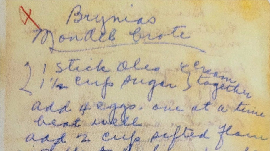 A Handwritten recipe of discolored paper written in blue ink.