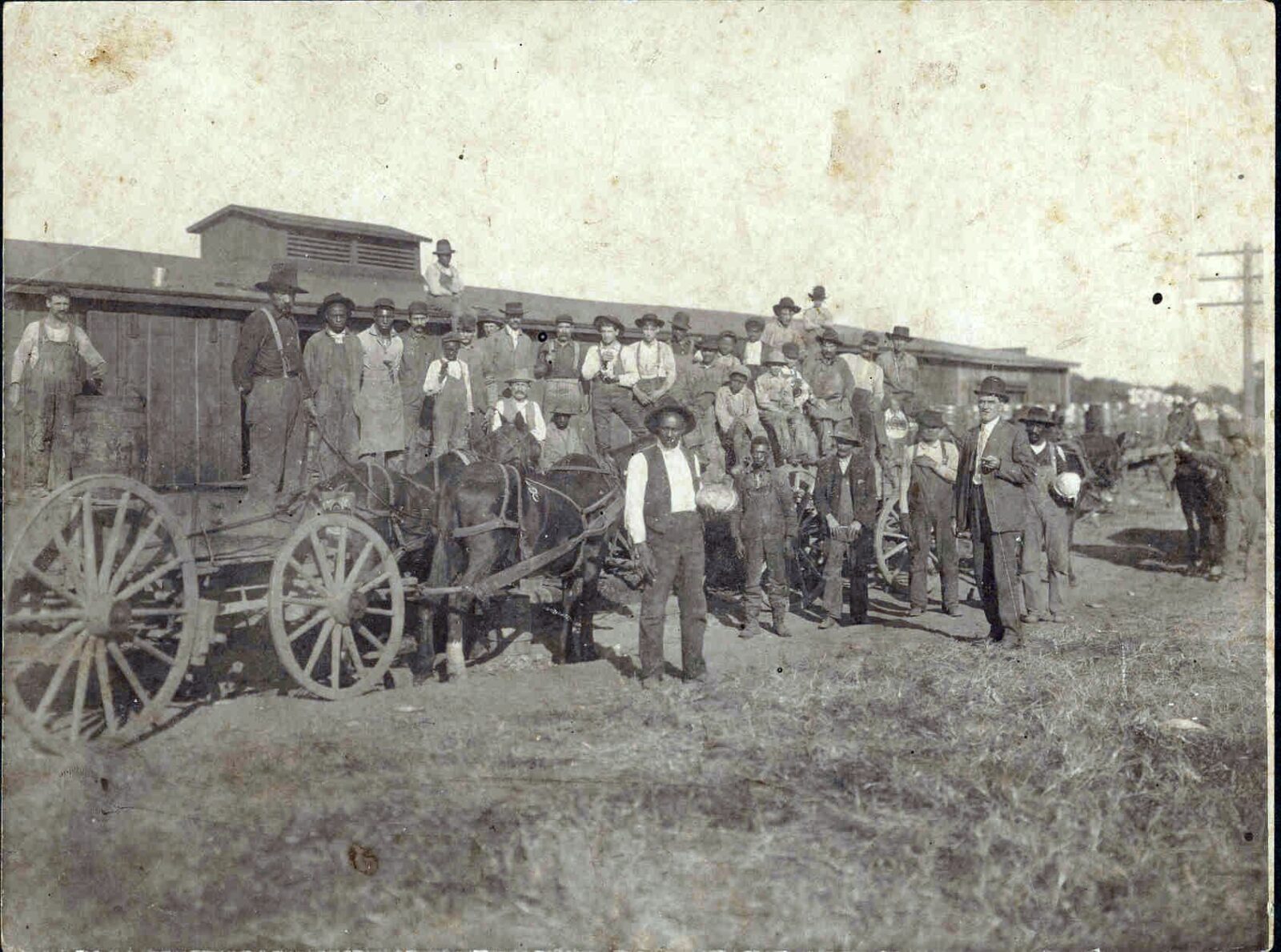 Junius Groves (center) grew more than just potatoes; he and his wife Matilda raised other vegetables and also tended orchards that produced apples, peaches and pears. (Photo courtesy, the Wyandotte County Historical Museum.)
