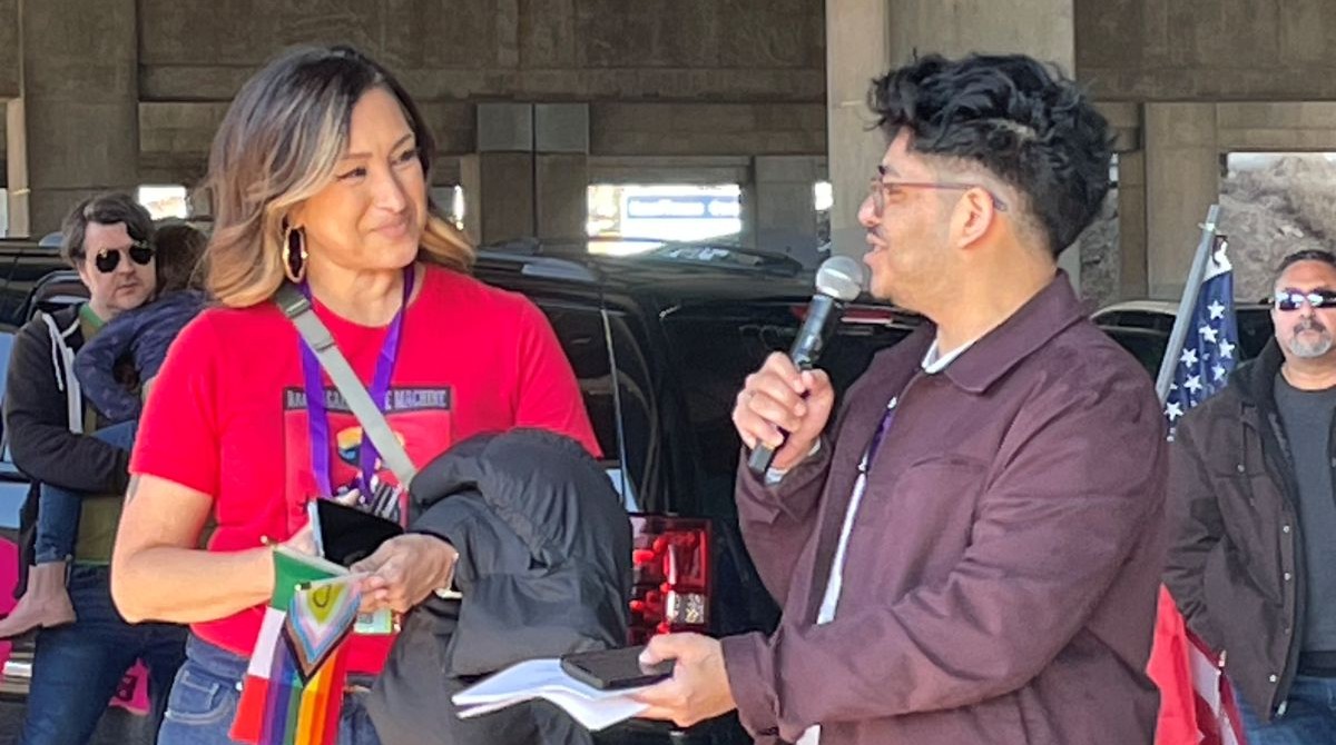 Deanna Munoz and Ivan Ramirez speak at a rally in support of the immigrant and LGBTQ communities on Feb. 23 in Kansas City. CoreCivic, a publicly traded operator of private prisons, wants to open a facility in Leavenworth, Kansas, to assist President Donald Trump's mass deportation plan. (Mary Sanchez/The Beacon)