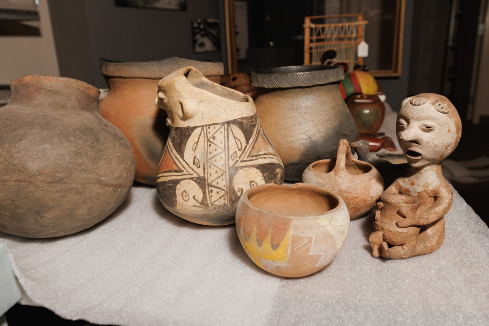 Native American pottery and artifacts fill a table at the Wyandotte County Historical Museum on March 26, 2025 in Bonner Springs, Kansas. (Chase Castor | Flatland)