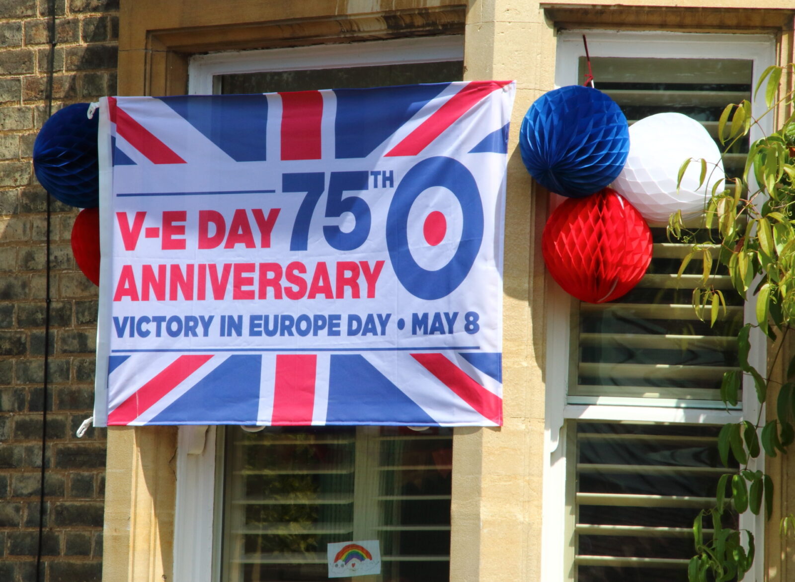 House decorated with a VE Day banner during the commemoration. The VE Day 75th anniversary, when Victory in Europe over the Germans was announced during World War Two, being commemorated during lockdown restrictions of the coronavirus COVID-19 pandemic. (Keith Mayhew | SOPA Images| Sipa US)| (Sipa via AP Images)