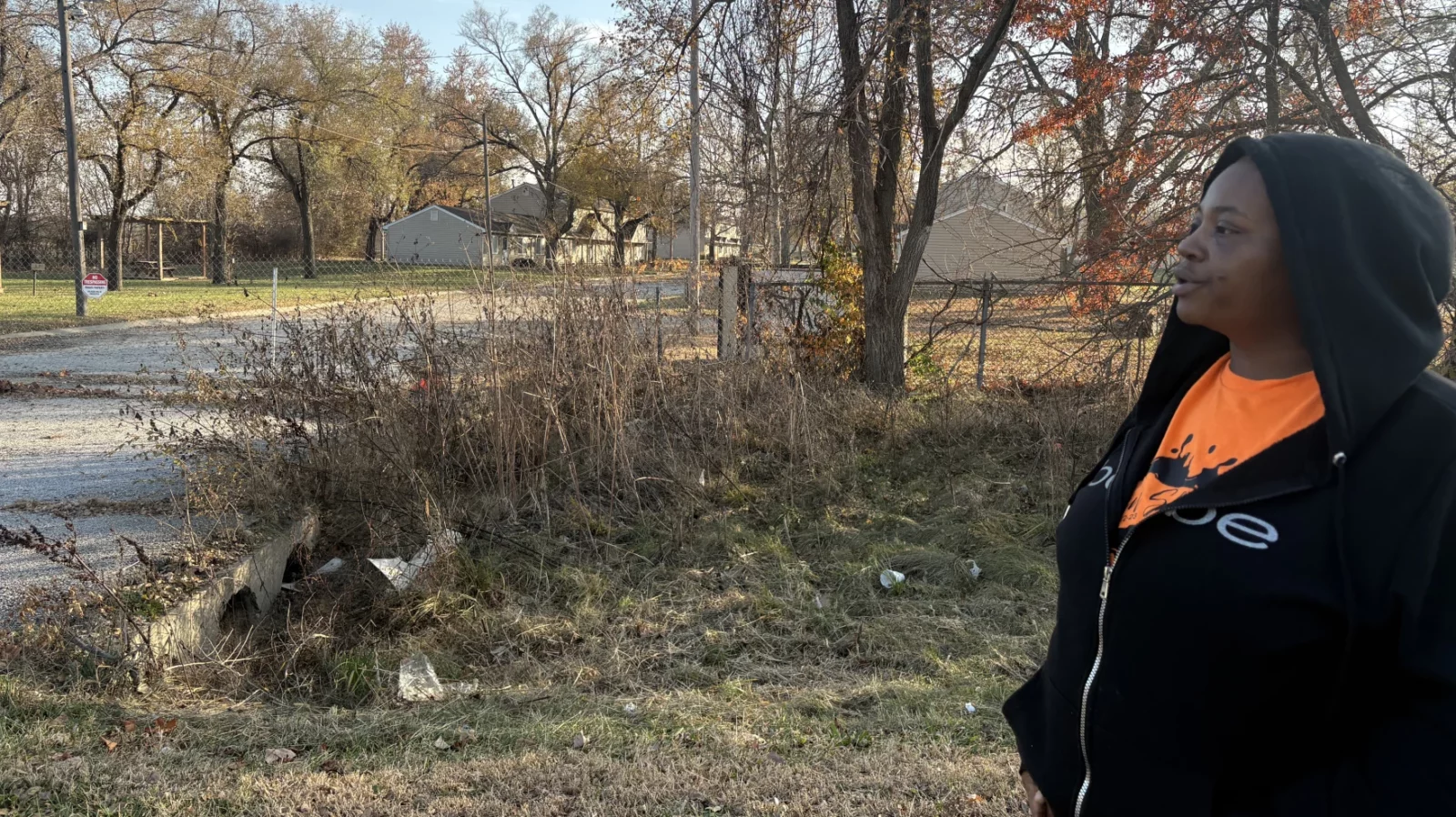 Candice Montgomery stands outside the closed Aspen Place apartment complex in Gardner, Kansas. She is one of hundreds of former residents who were kicked out of their homes when Gardner officials condemned the property. (Dylan Lysen | Kansas News Service