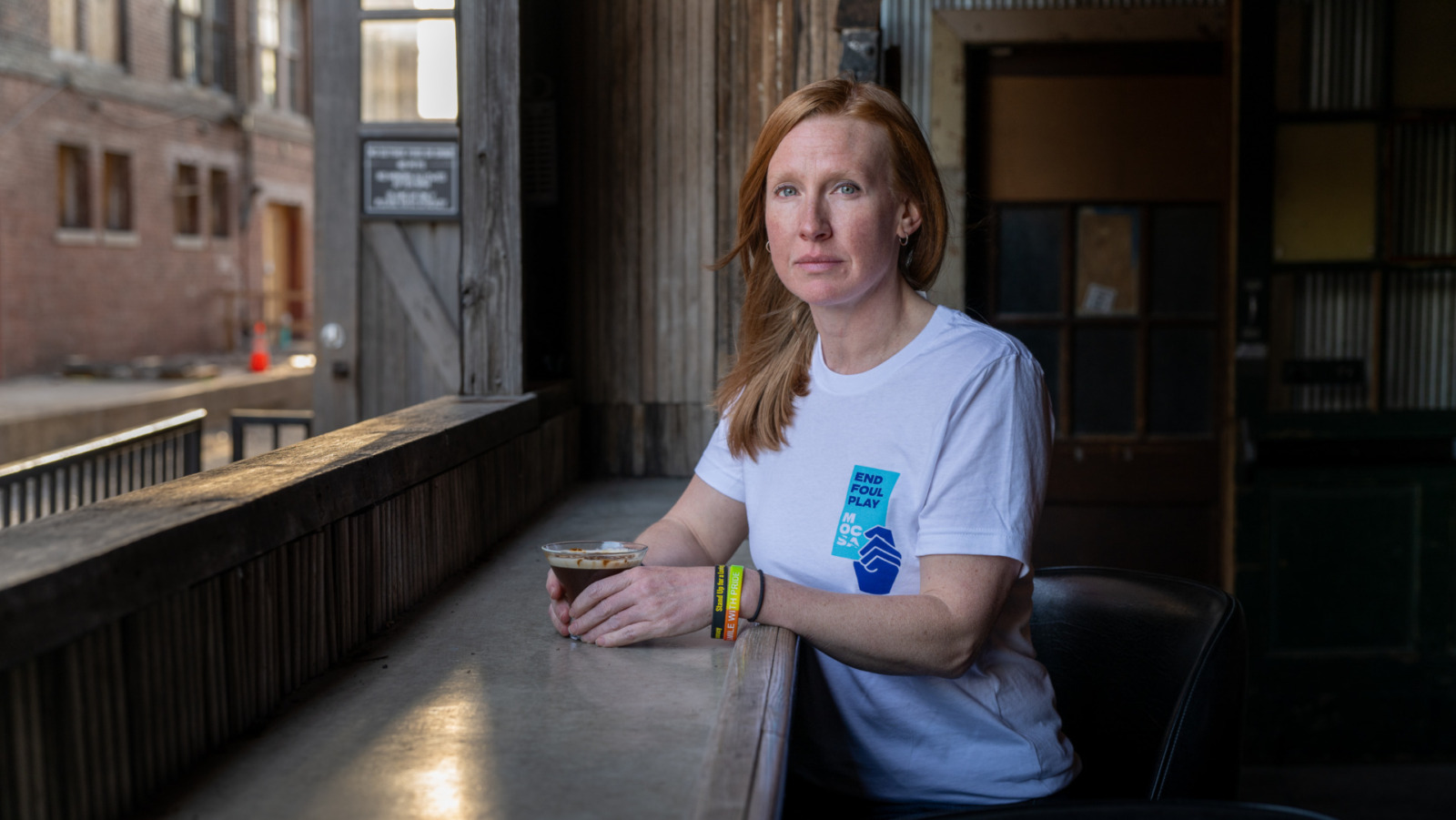 Jennifer Kabler is a sexual assault survivor who volunteers with the Metropolitan Organization Countering Sexual Assault (MOCSA), based in Kansas City, Missouri. She is photographed here at The Ship, a restaurant and bar in the West Bottoms, at a Sexual Assault Awareness Month Day of Action Celebration on April 7, 2026.