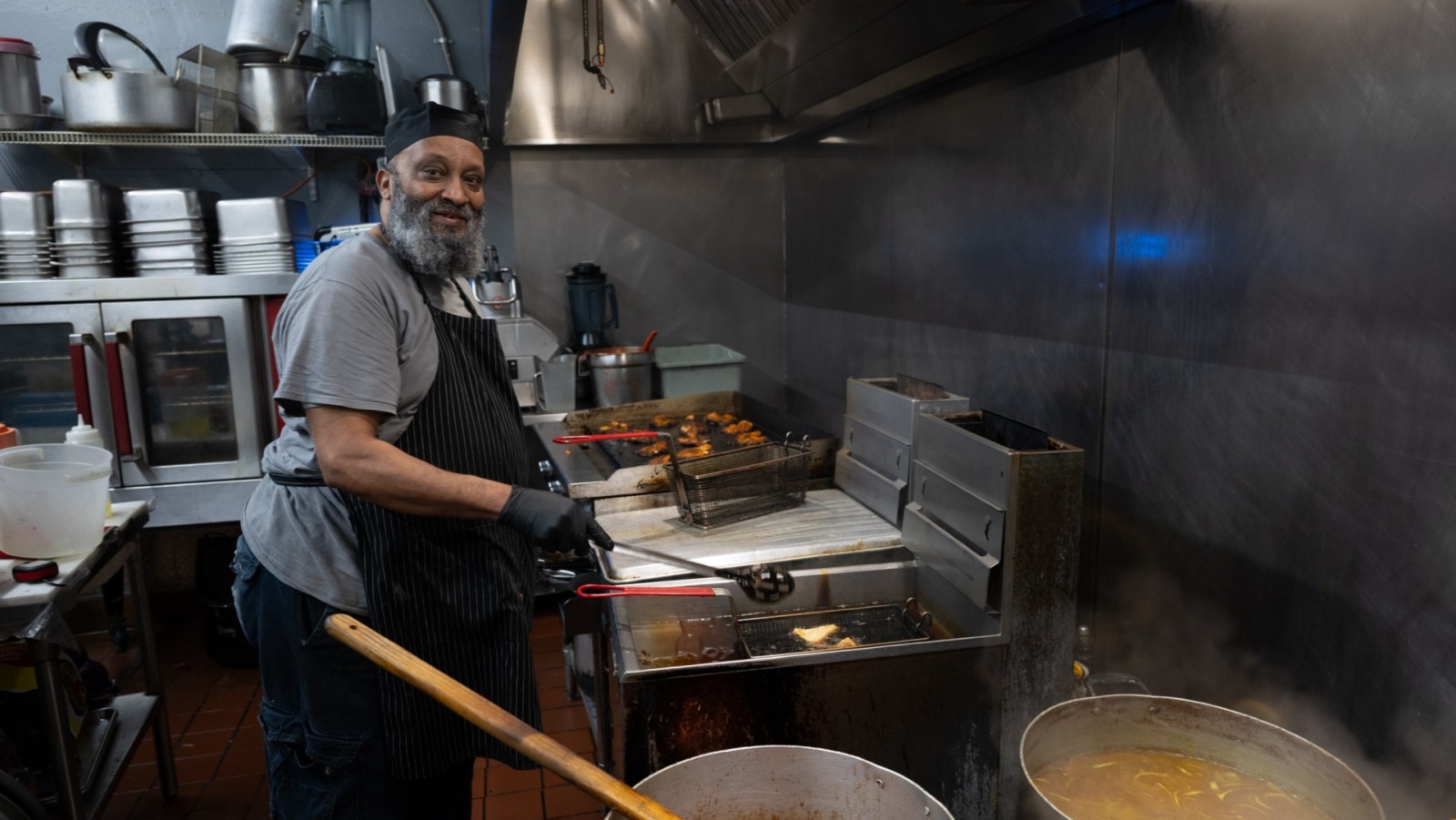 Chef/owner Abdul Hatimi of Yasmeen Cafe, located at 1447 Independence Ave., works in his kitchen recently for the lunch hour. (Todd Feeback | Flatland)