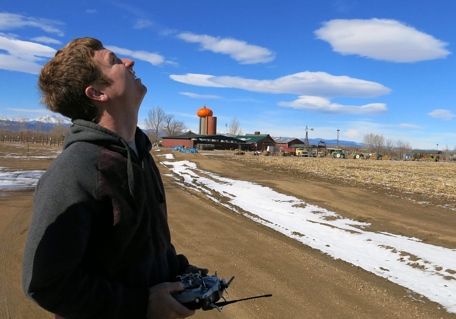 Technician Jimmy Underhill pilots a drone over fields in Weld County, Colorado. (Photo: Luke Runyon/Harvest Public Media)
