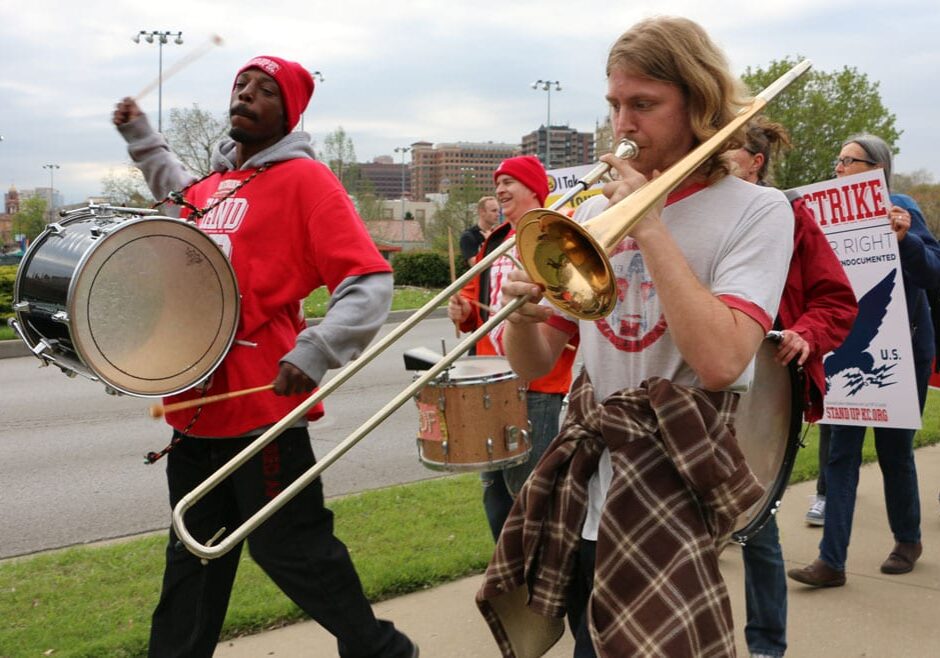 protesters marching with instruments