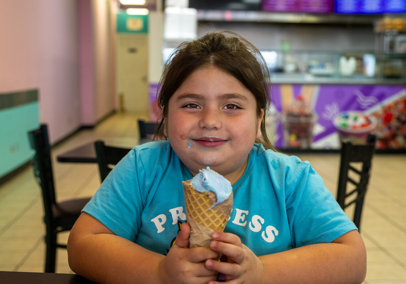 Yazmine Guerrero, 7, of St. Joseph, Missouri, enjoyed a bubblegum ice cream waffle cone recently at Frutopia, located at 3737 Independence Avenue in Kansas City, Missouri. Frutopia is a Mexican paleteria, ice cream shop, and grill. (Todd Feeback | Flatland)