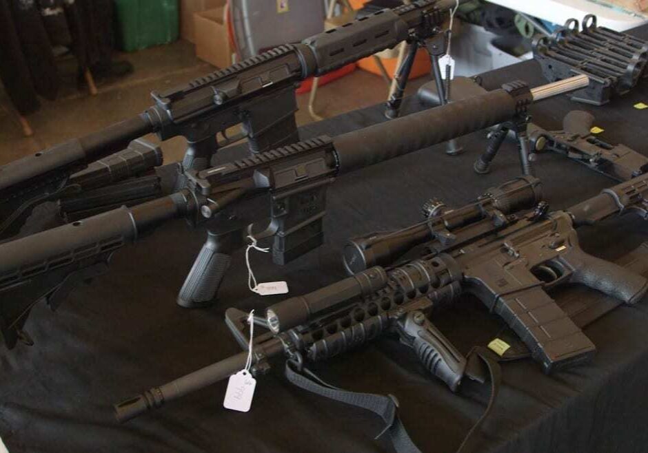 Rifles for sale at the Kansas Prepper Expo in Holton, Kan.