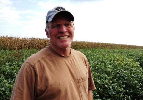 Fifth-generation farmer Richard Oswald stands in a field of soybeans that's worth a lot less than it would have been last year, partly thanks to a downturn in the economy of China. (Photo: Frank Morris | Harvest Public Media)