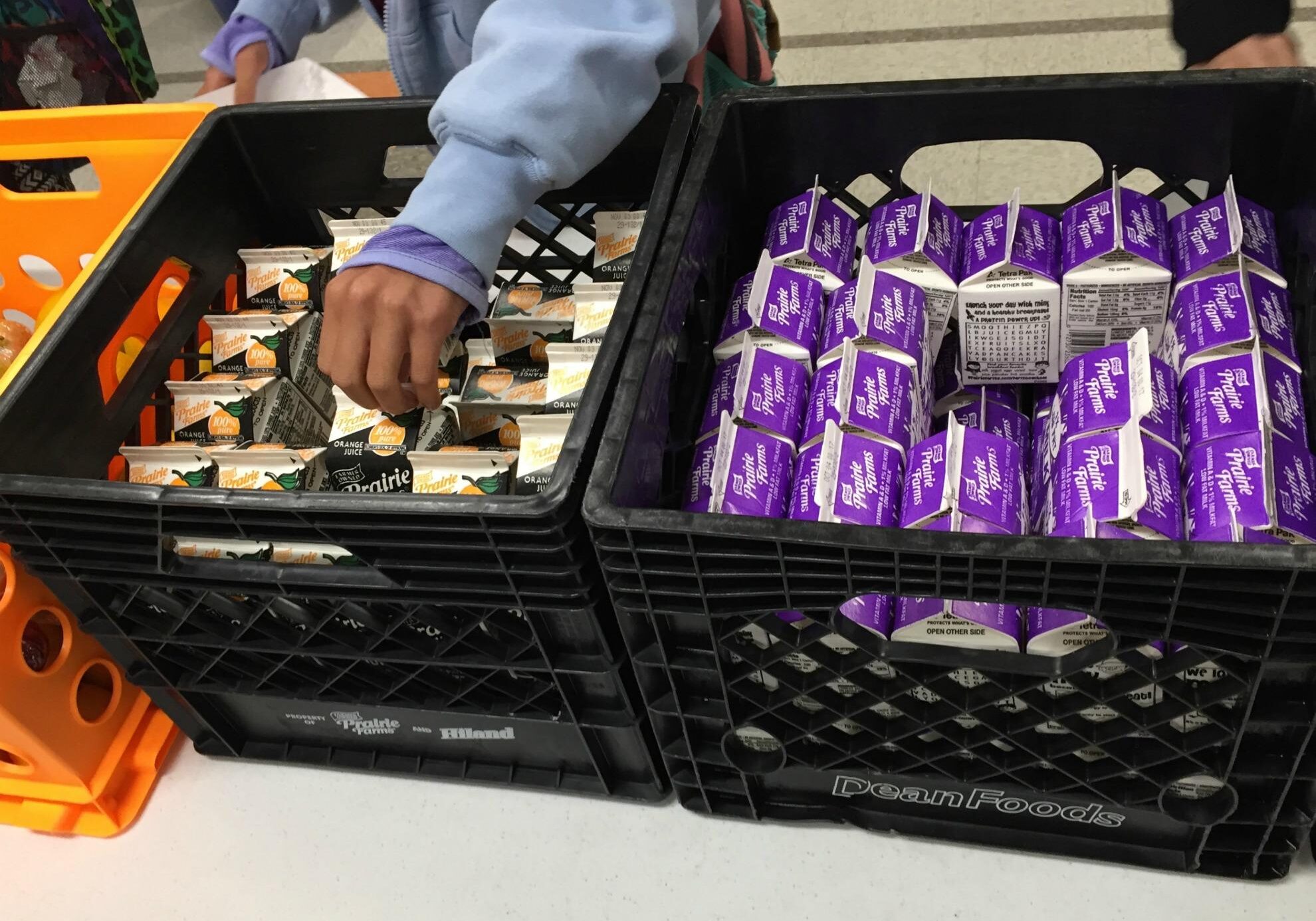 Milk cartons in a bin.