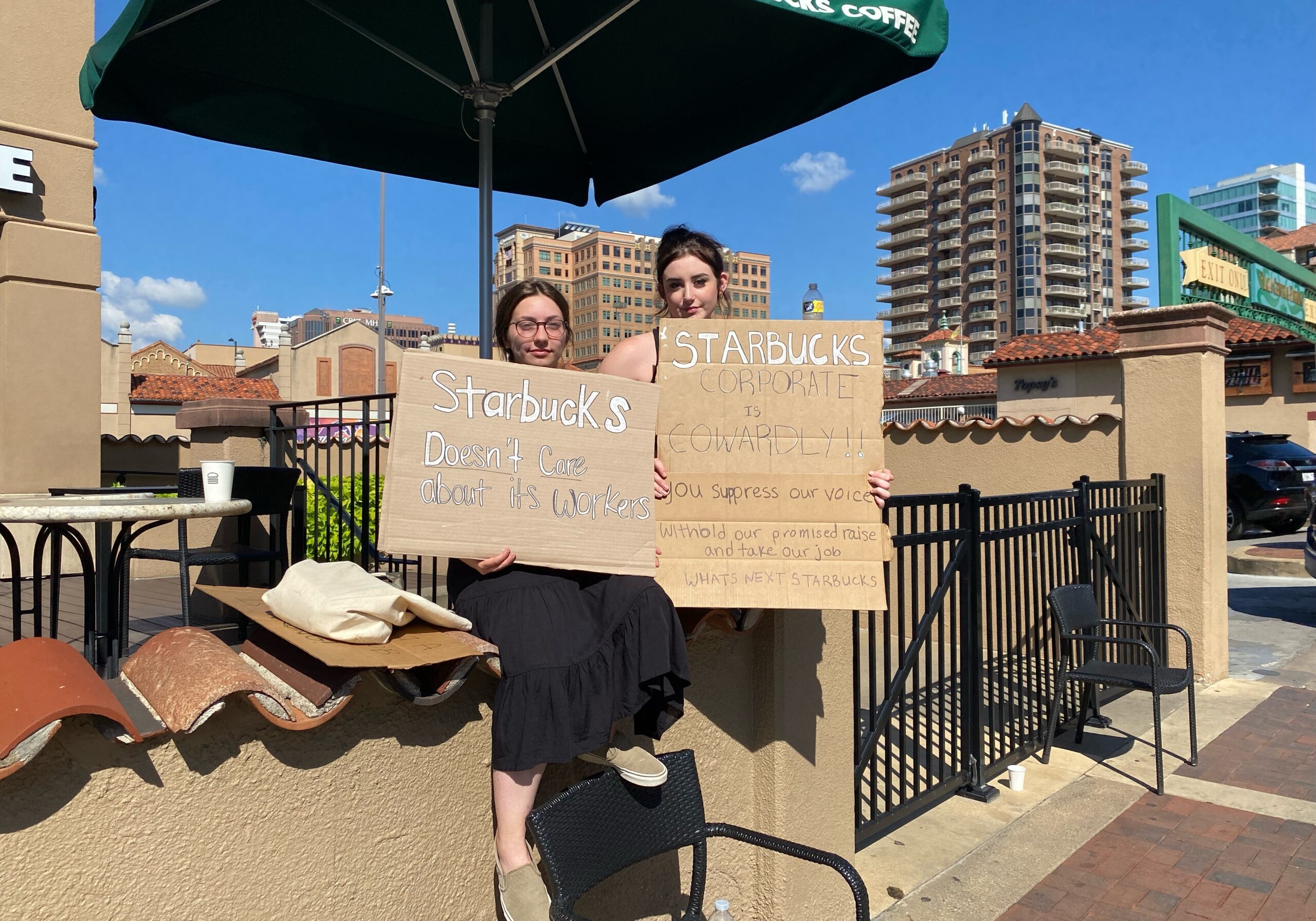 McKenzie Mays and Addy Wright protest outside of their former employer, Starbucks.