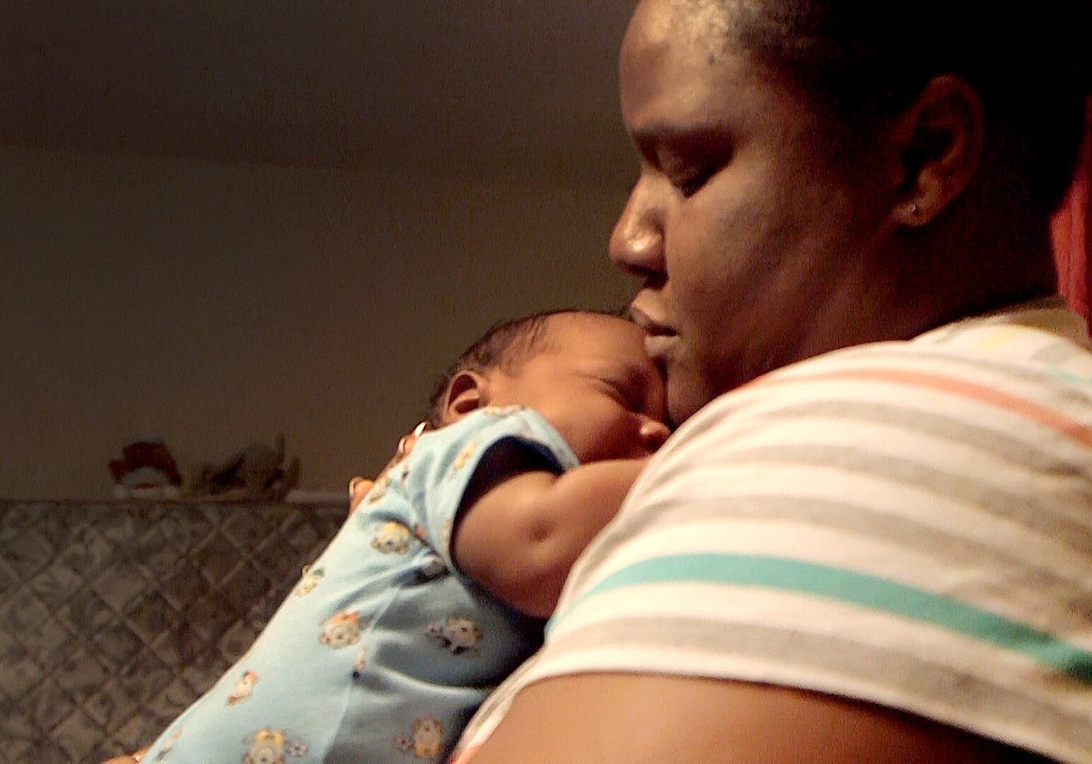 Erica Hardin held her 3-month-old son, Marcus, recently in her home. Hardin said she is grateful for a program of the Mother & Child Health Coalition, Kansas City Healthy Start, as they helped her with both of her pregnancies. (Photo by Todd Feeback/Flatland)