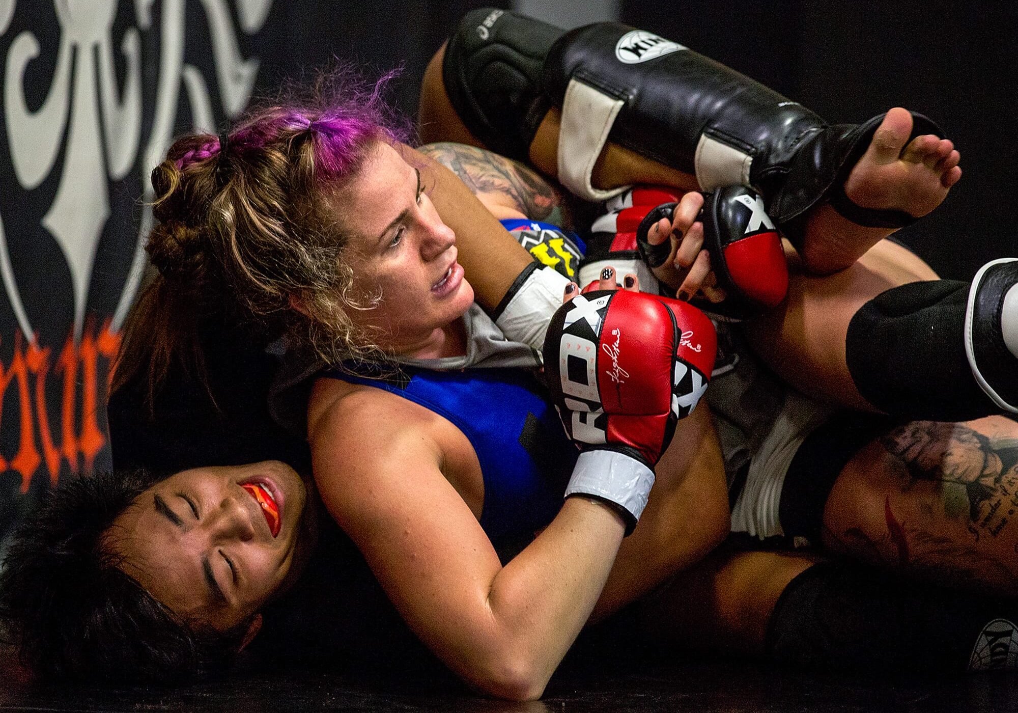 Professional fighter Gina Mazany practices during a training session at Xtreme Couture Mixed Martial Arts in Las Vegas. She well remembers her first concussion — which came in her first fight. "I was throwing up that night," Mazany say