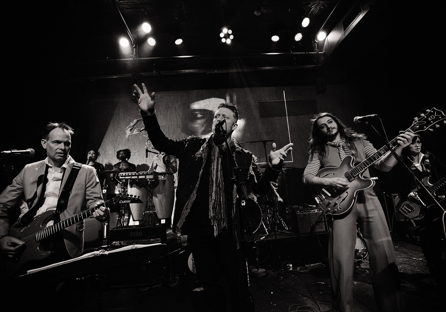 The Band That Fell to Earth plays music on stage.