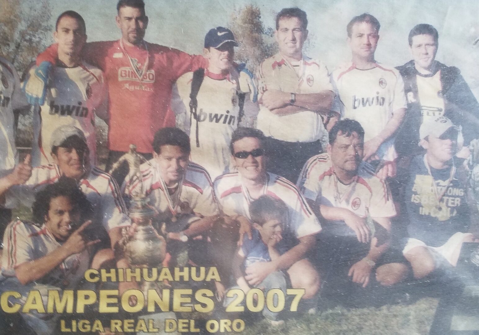 The Santa Fe Wanderers soccer club pose with a trophy