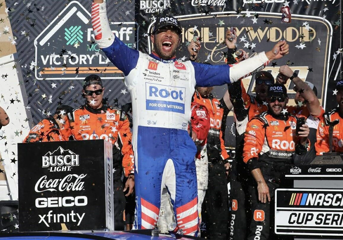 NASCAR driver Bubba Wallace celebrates a win at Kansas Speedway.