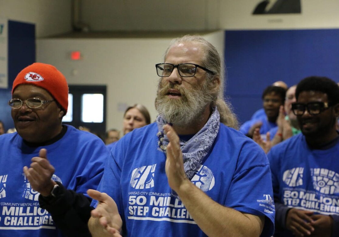 man cheers with team