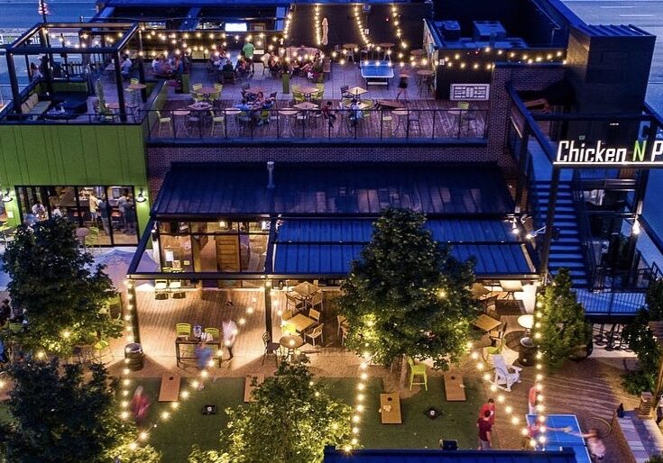 An aerial view of Chicken N Pickle restaurant and pickle ball courts.