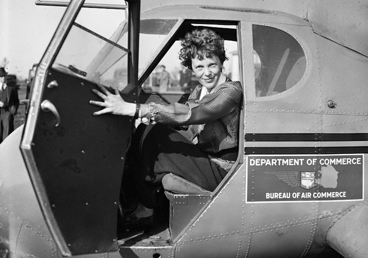 Amelia Earhart, shone here in an airplane, helped establish the Ninety-Nines in 1929.