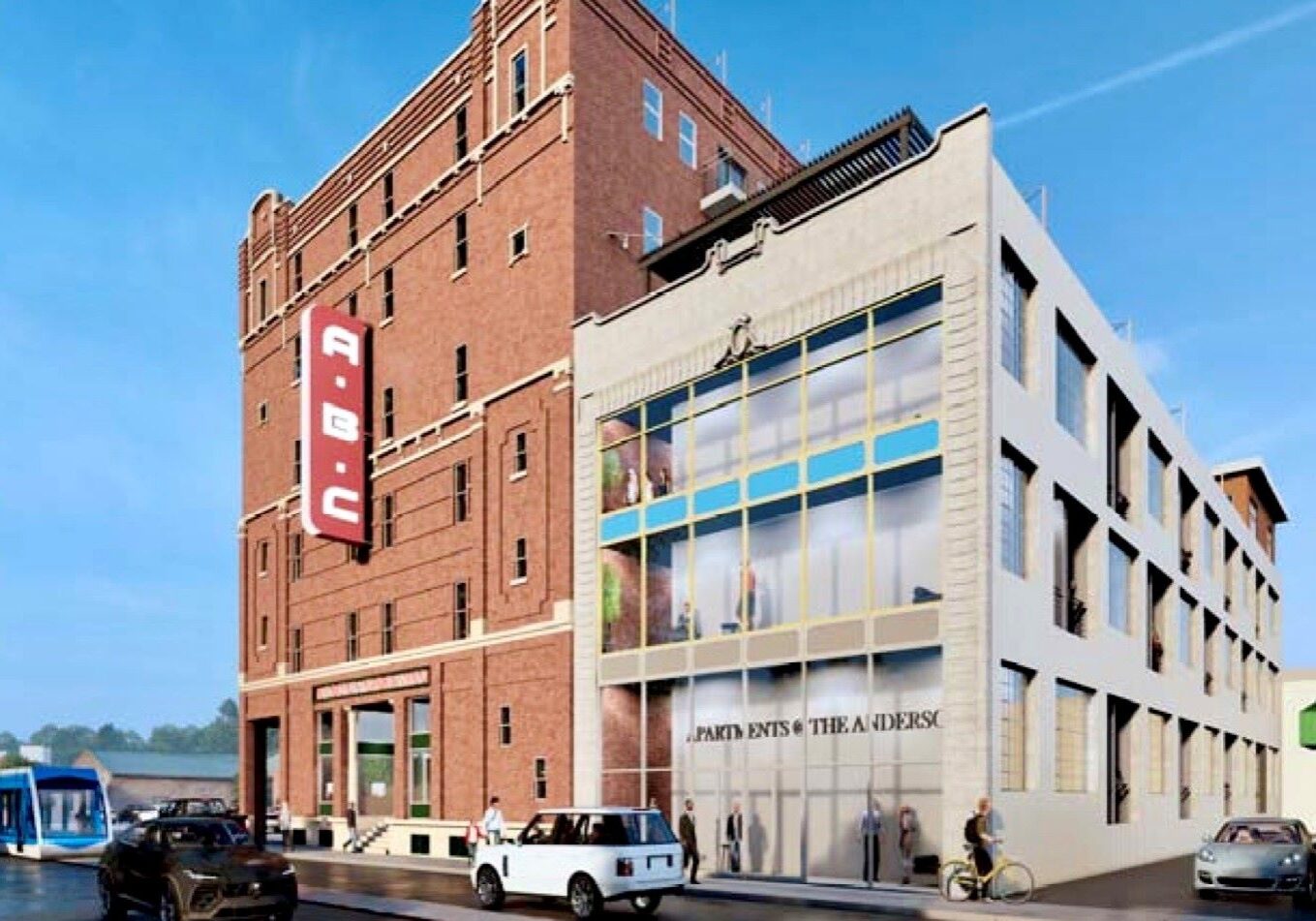 The six-story historic ABC Storage building at 3244 Main St. and the adjoining former Anderson Electric Car building.