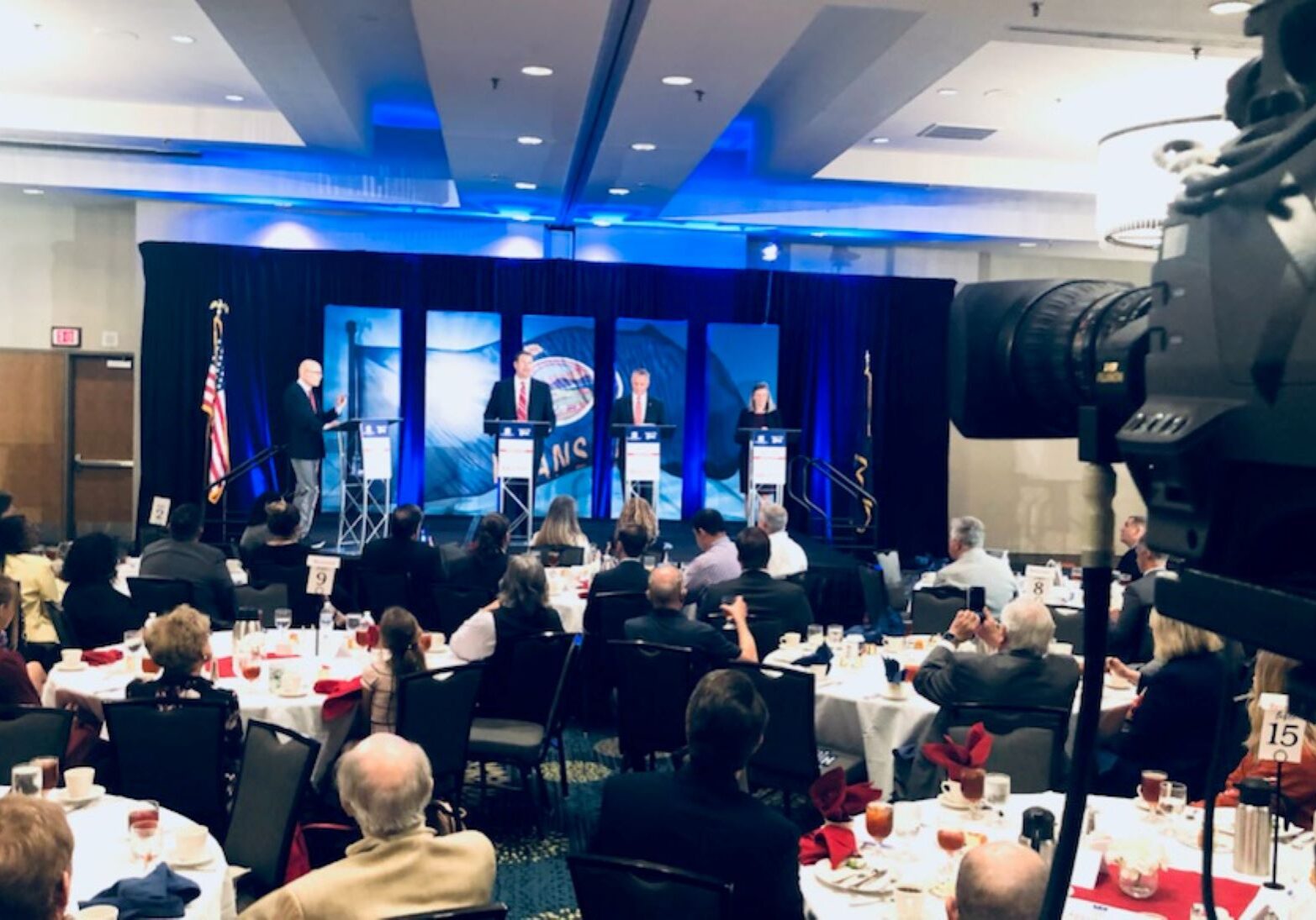 Republican candidates for Kansas attorney general - Kris Kobach, Tony Mattivi and Kellie Warren - on stage at the DoubleTree Hotel in Overland Park..