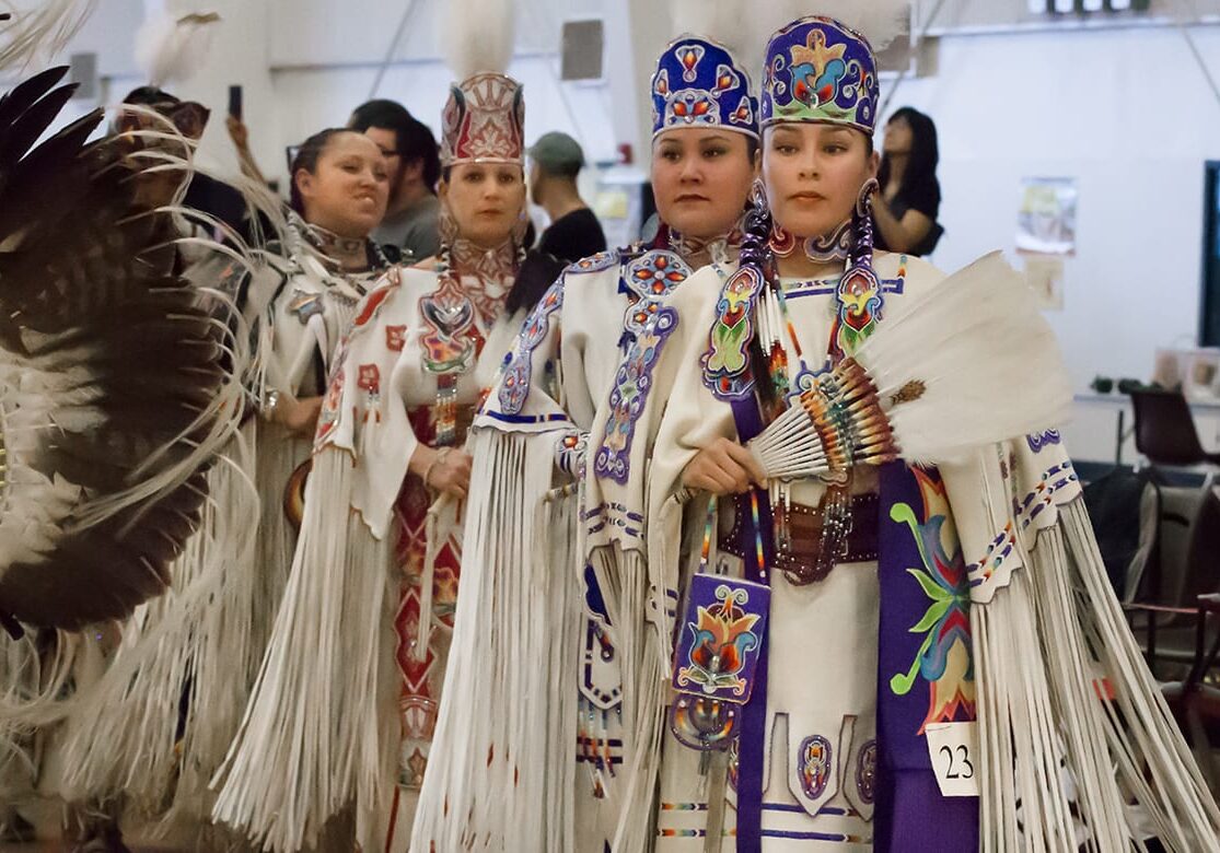 The junior and senior buckskin dancers line up