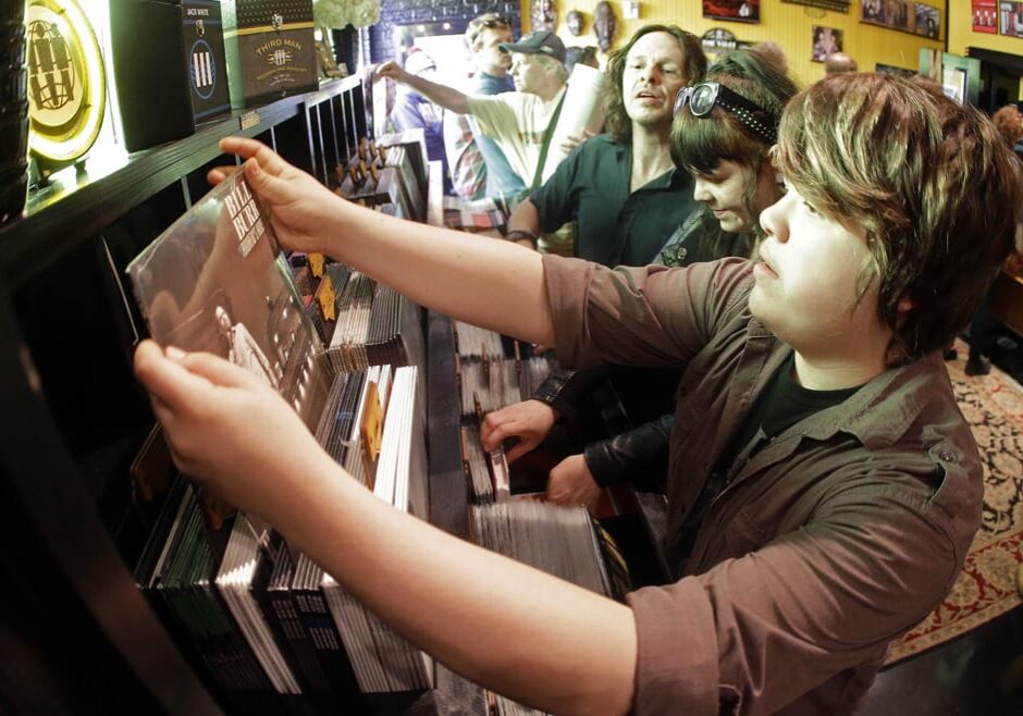 People looking through records at a store
