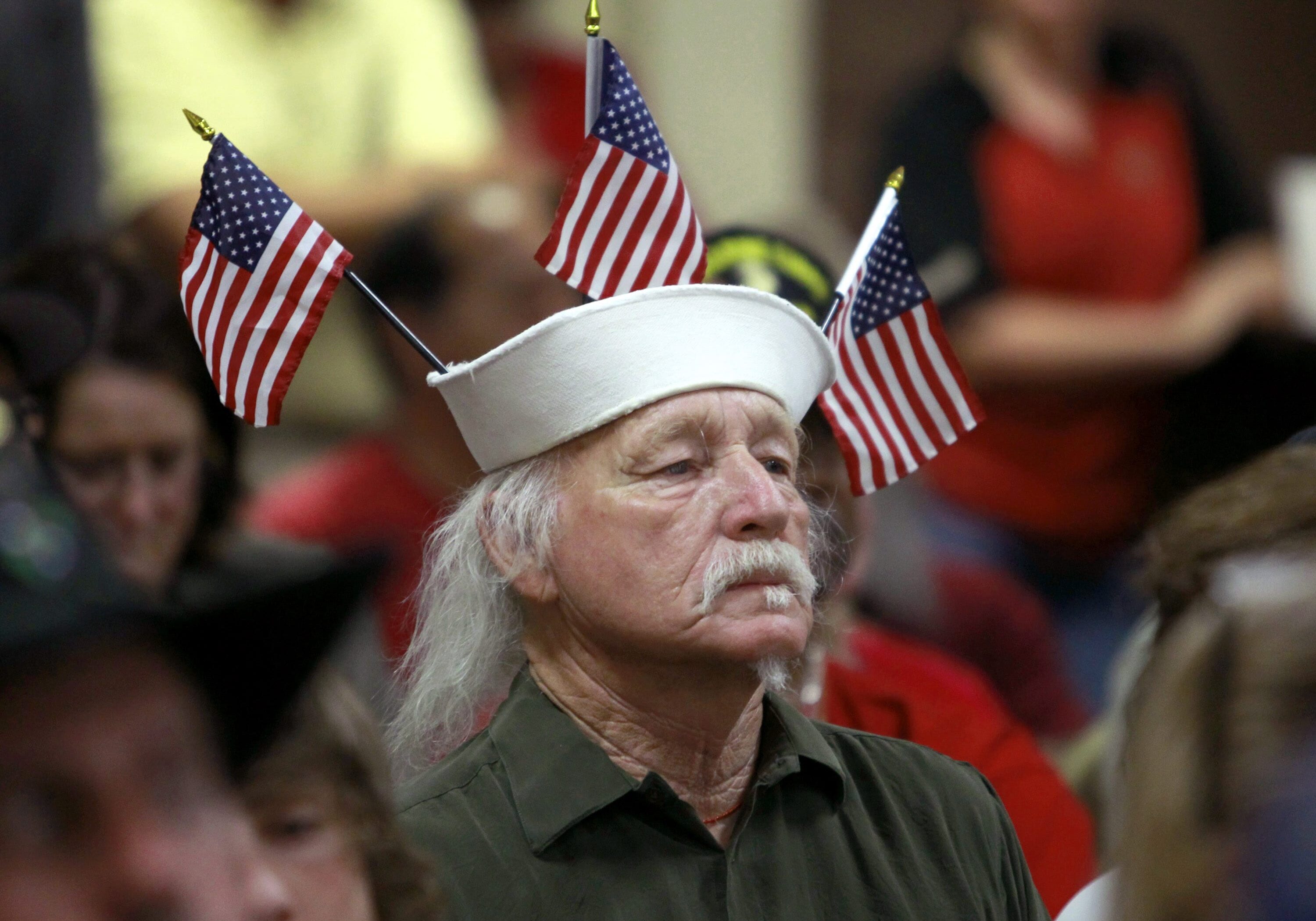 Vietnam veteran Louis Albin, who served in the U.S. Navy, listens during a town hall meeting at American Legion Post 1 on Monday, June 9, 2014, in Phoenix concerning health-care issues at the Phoenix VA facilities. One Veterans Affairs Department health care system in Arizona has been flagged for further review following a nationwide audit of the agency's troubled appointment process, according to a report released Monday. (AP Photo/Ralph Freso)