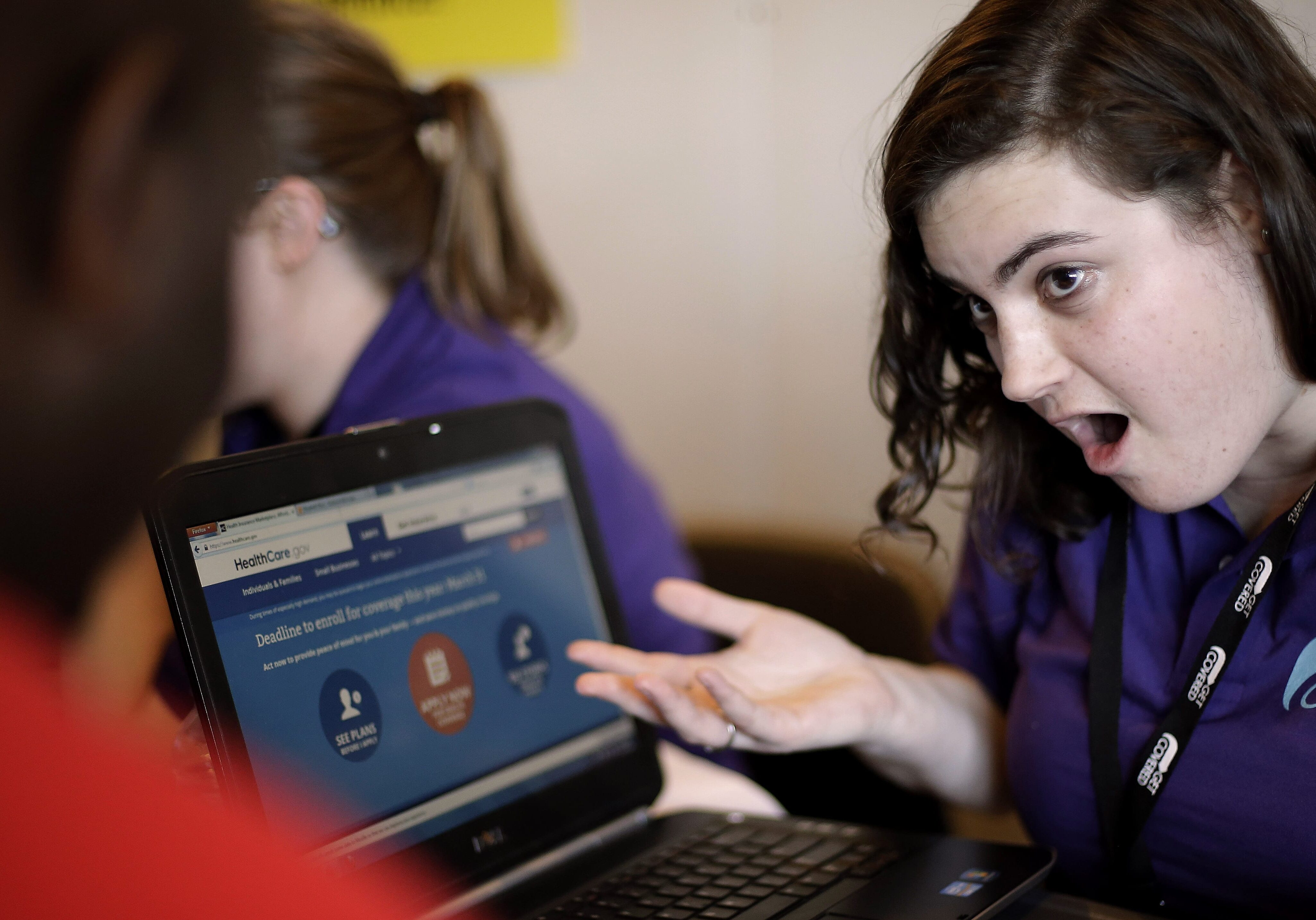FILE - In this March 31, 2014, file photo, Elizabeth Rich helps a man sign up for the Affordable Care Act at Swope Health Services in Kansas City, Mo. Heres more fallout from the health care law: Healthy customers with money to spend will no longer be able to walk into a private insurance office or go online and buy standard coverage any time of year. With limited exceptions, insurers dont plan to sell to individuals outside the open enrollment period in HealthCare.gov and the state insurance marketplaces. (AP Photo/Charlie Riedel)