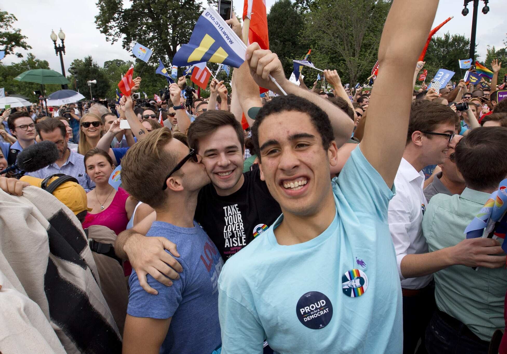 Supporters of same-sex marriage celebrate outside of the Supreme Court in Washington, Friday June 26, 2015, after the court declared that same-sex couples have a right to marry anywhere in the US. (AP Photo/Jacquelyn Martin)