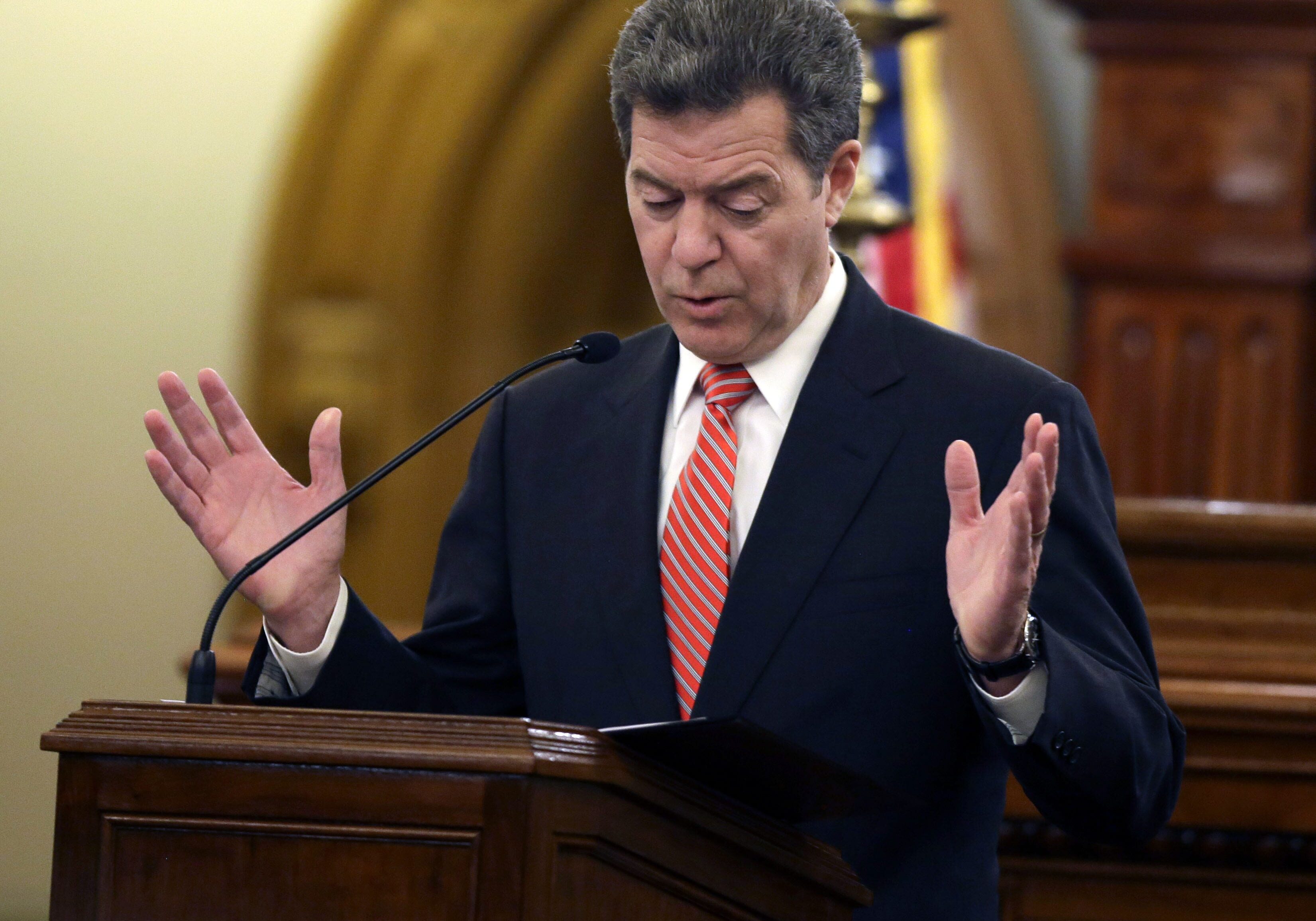 Gov. Sam Brownback delivers his State of the State address at the Kansas Statehouse in Topeka, Kan., Thursday, Jan. 15, 2015. (AP Photo/Orlin Wagner)