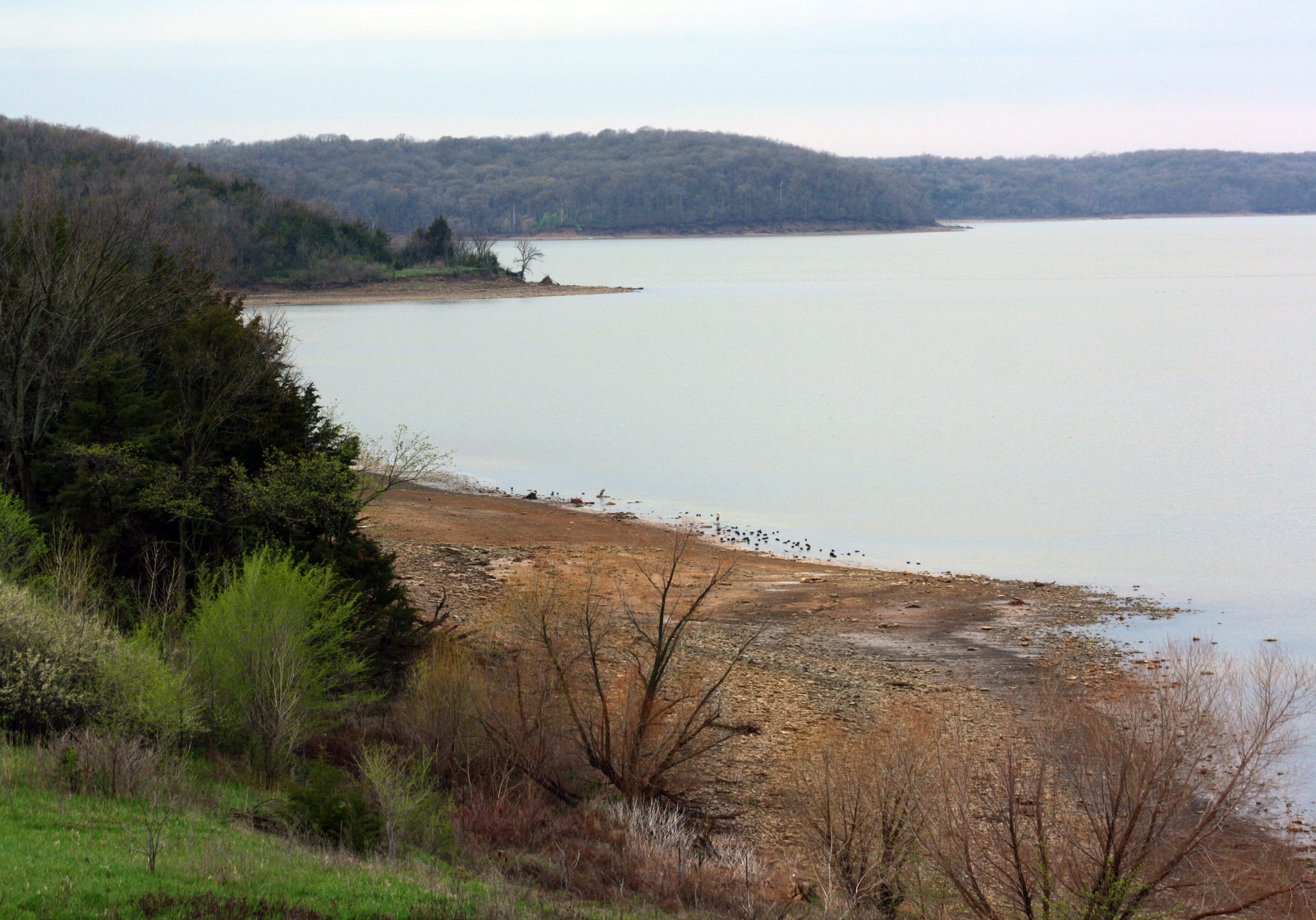In this Friday, April 26, 2013 photo, the water level is below normal after two years of drought at Clinton Lake, southwest of Lawrence, Kan. State officials hope that improving weather conditions will restore lake levels across the state. (AP Photo/John Milburn)